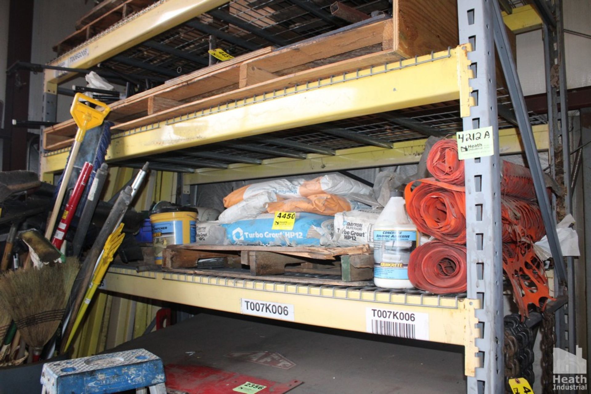 CONTENTS ON SHELF INCLUDING GROUT, SNOW FENCE AND ELECTRIC MOTORS