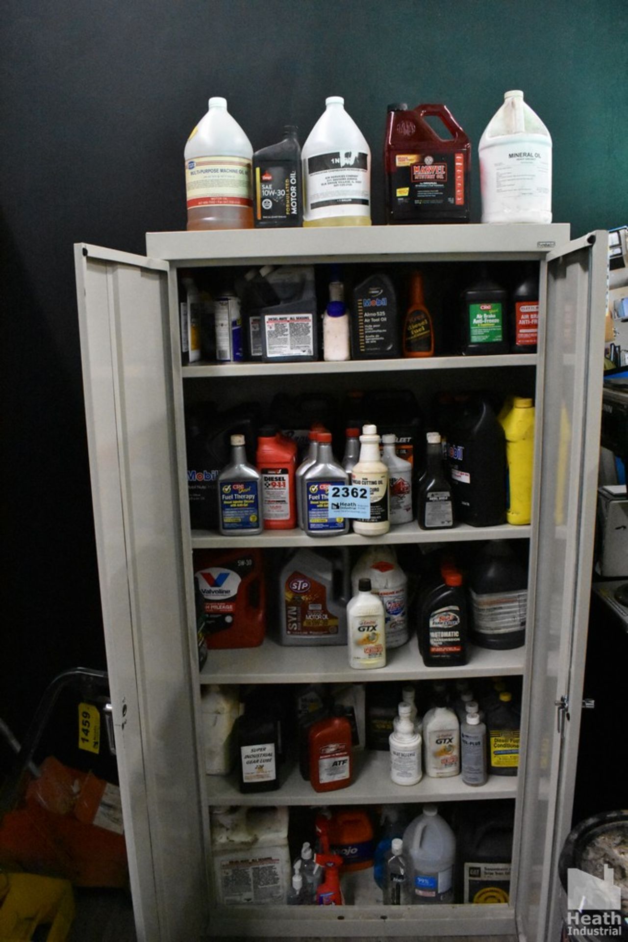 LARGE QUANTITY OF OIL AND FLUID IN CABINET(NO CABINET)
