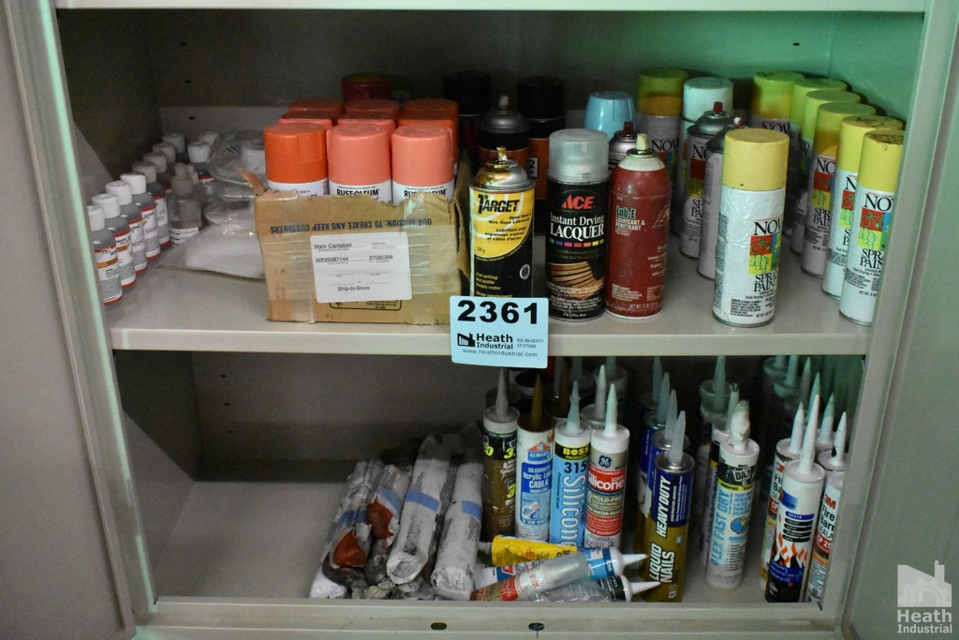 ASSORTED SPRAY PAINT AND CAULK ON TWO SHELVES