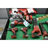 ASSORTED MILWAUKEE TOOLS ON TABLE, WITH CHARGER, BATTERY AND CARRYING BAG