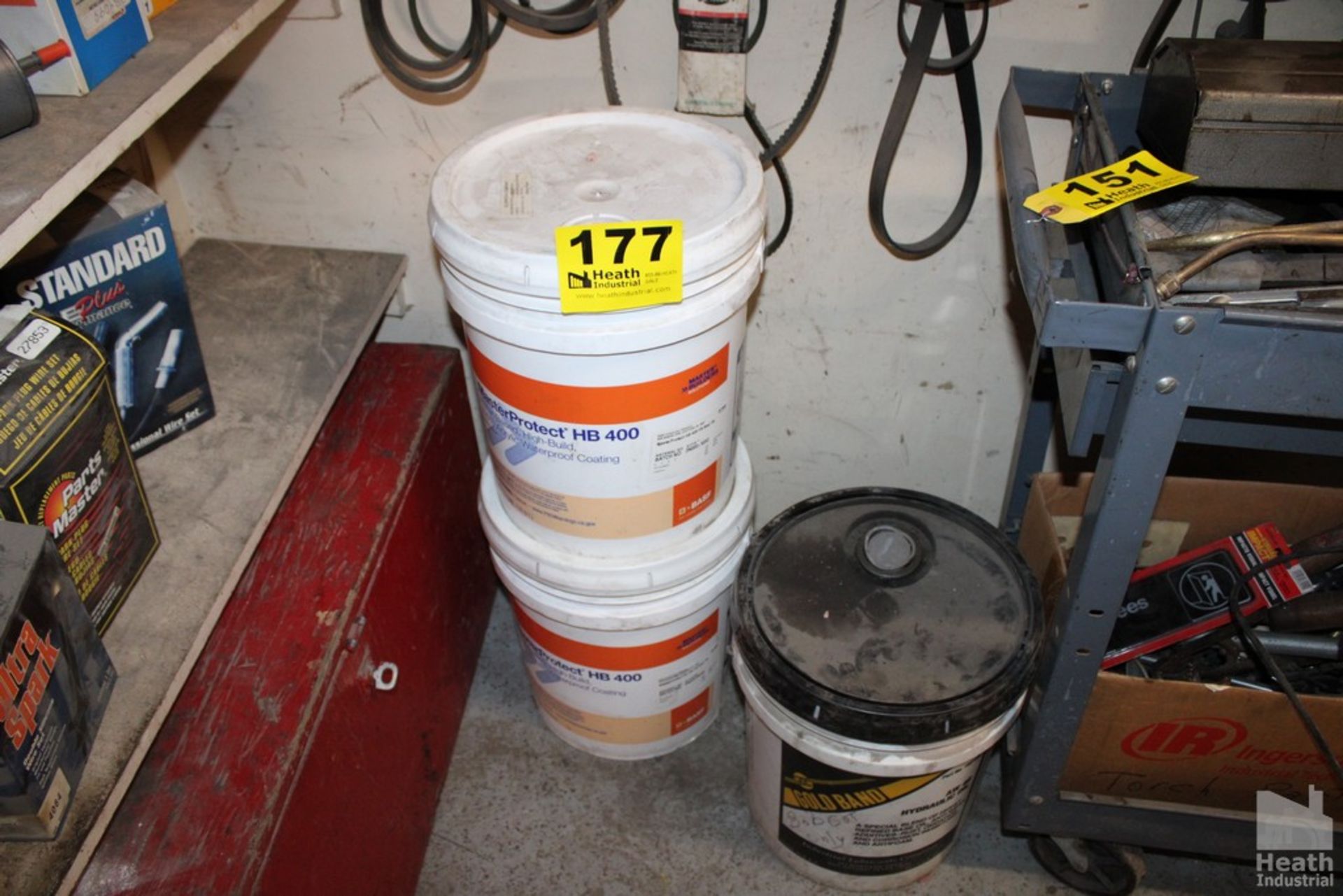 (2) FIVE GALLON PAILS OF WATERPROOF COATING AND (1) OF HYDRAULIC OIL