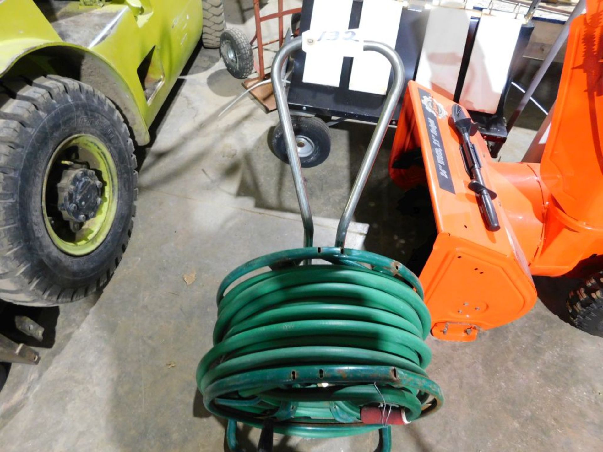 Water hose w/cart. (Located at and to be picked up at: 2862 Wagner Rd., Waterloo, IA)