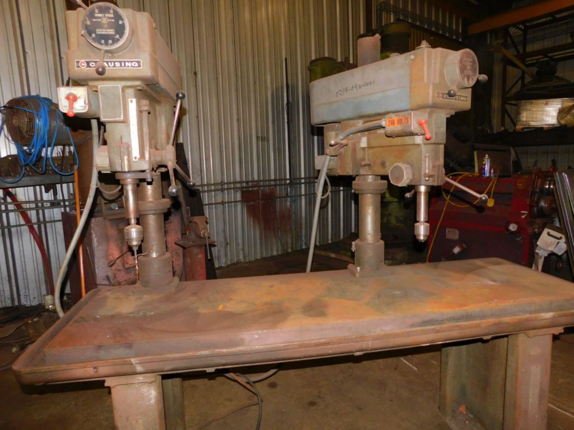 Clausing double head drill press, (1) head 3 ph, (1) head 240, 1 ph, 7 ft. table. (LOCATED AT and to