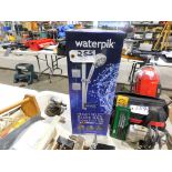 WaterPik shower system. (Located at and to be picked up at: 2862 Wagner Rd., Waterloo, IA)