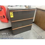 Three drawer file cabinet with color charts, and wood clamps