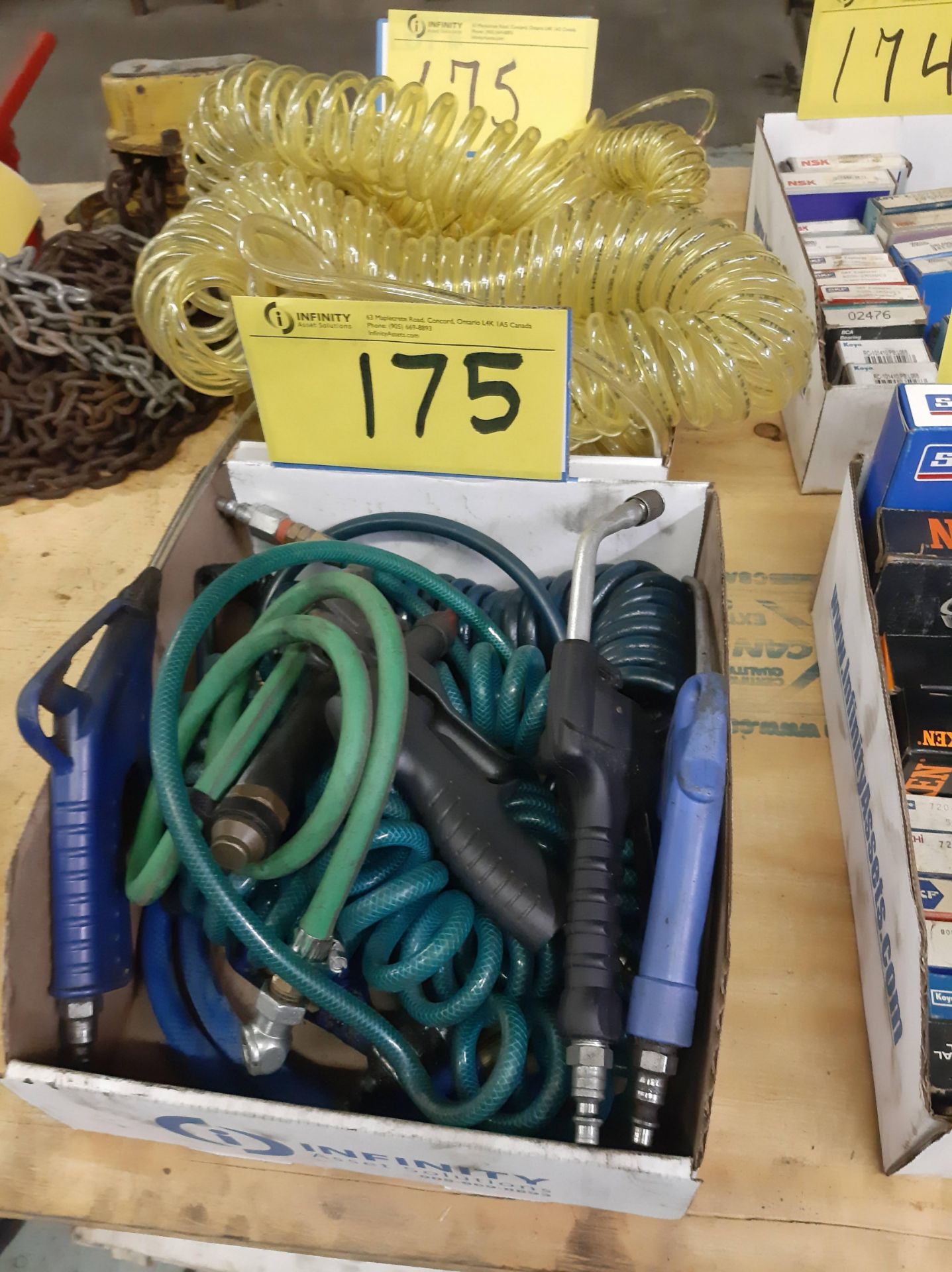 LOT OF (2) BOXES OF RETRACTABLE AIR HOSE AND NOZZLES