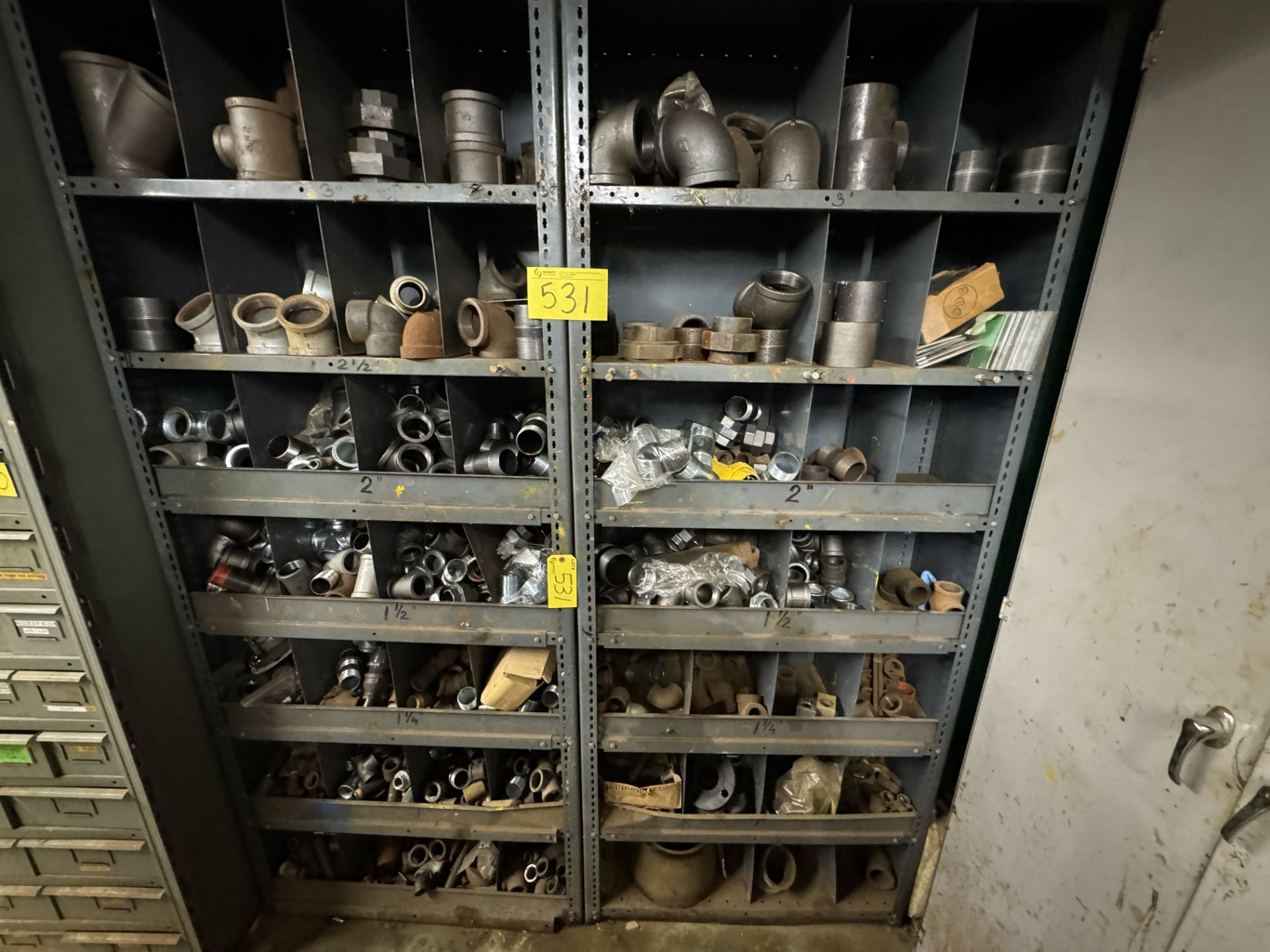 LOT OF SHELVING UNITS W/ PARTS BINS INCLUDING PIPE FITTINGS