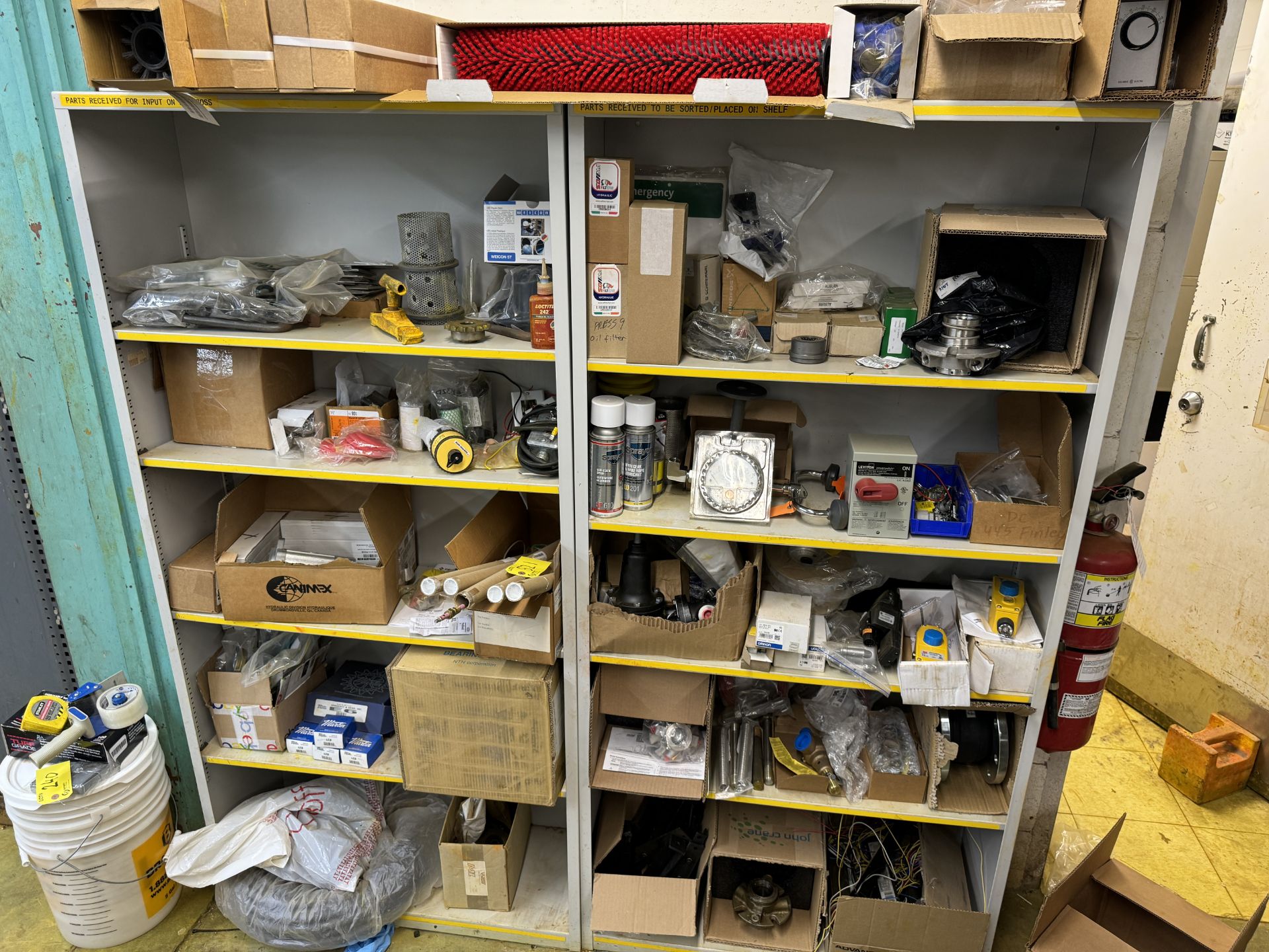 LOT OF (2) METAL SHELVING UNITS W/ PARTS INCLUDING BALLASTS, VALVES, FILTER HOUSING, METERS, FILERS,