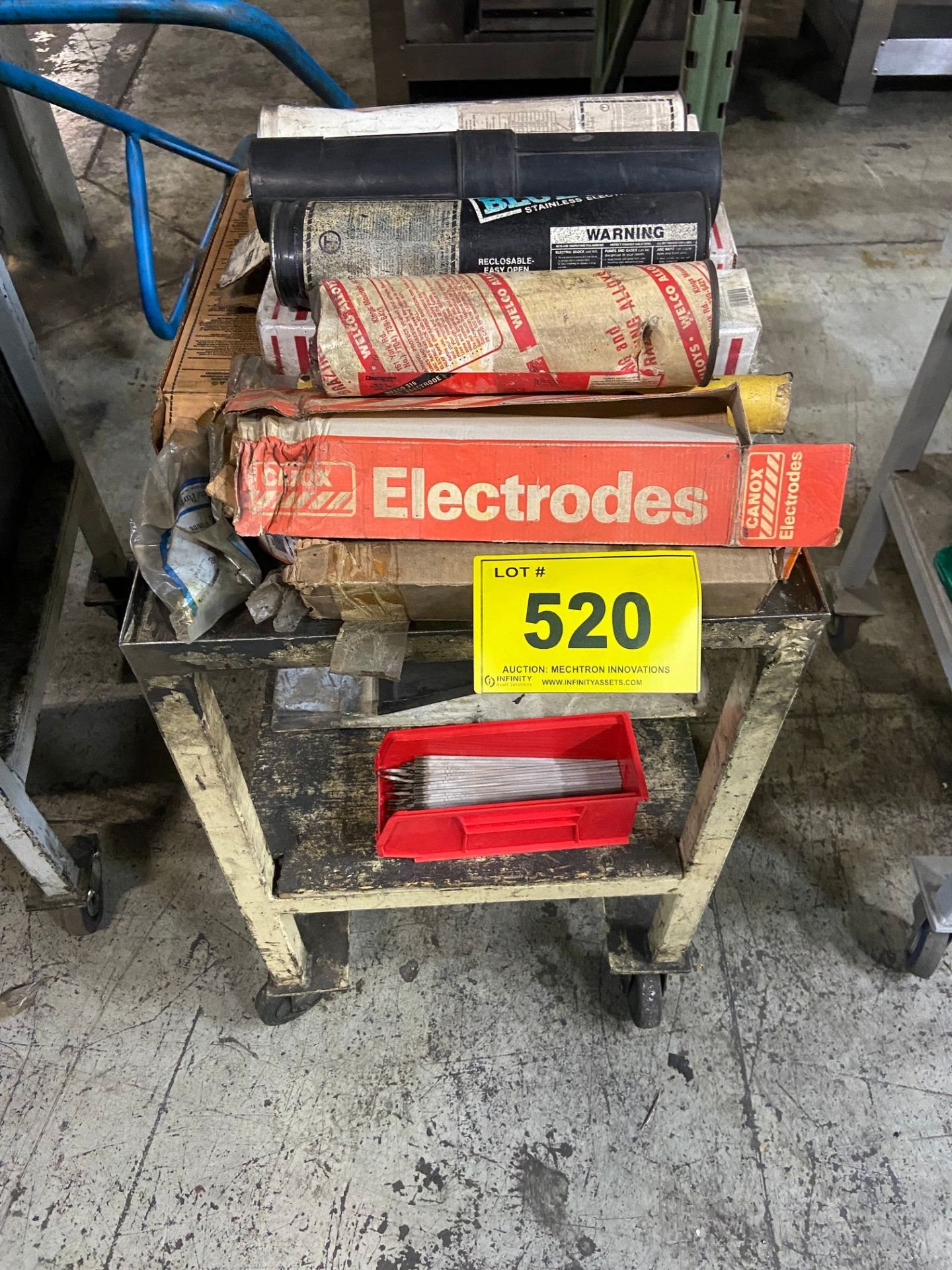 ASSORTED WELDING RODS & TABLE ON CASTORS