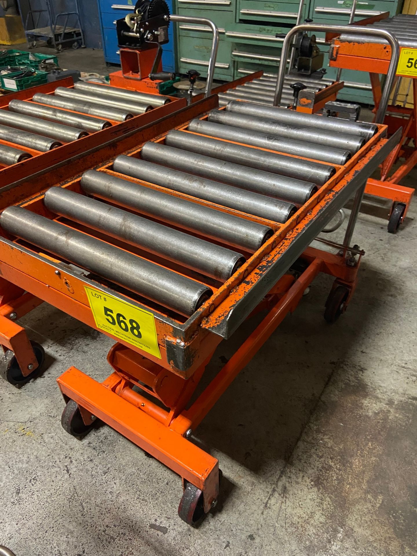 PORTABLE DIE LIFT TABLE ON CASTORS, 1650 LBS, C/W 19" X 39" ROLL TOP CONVEYOR & CABLE WINCH