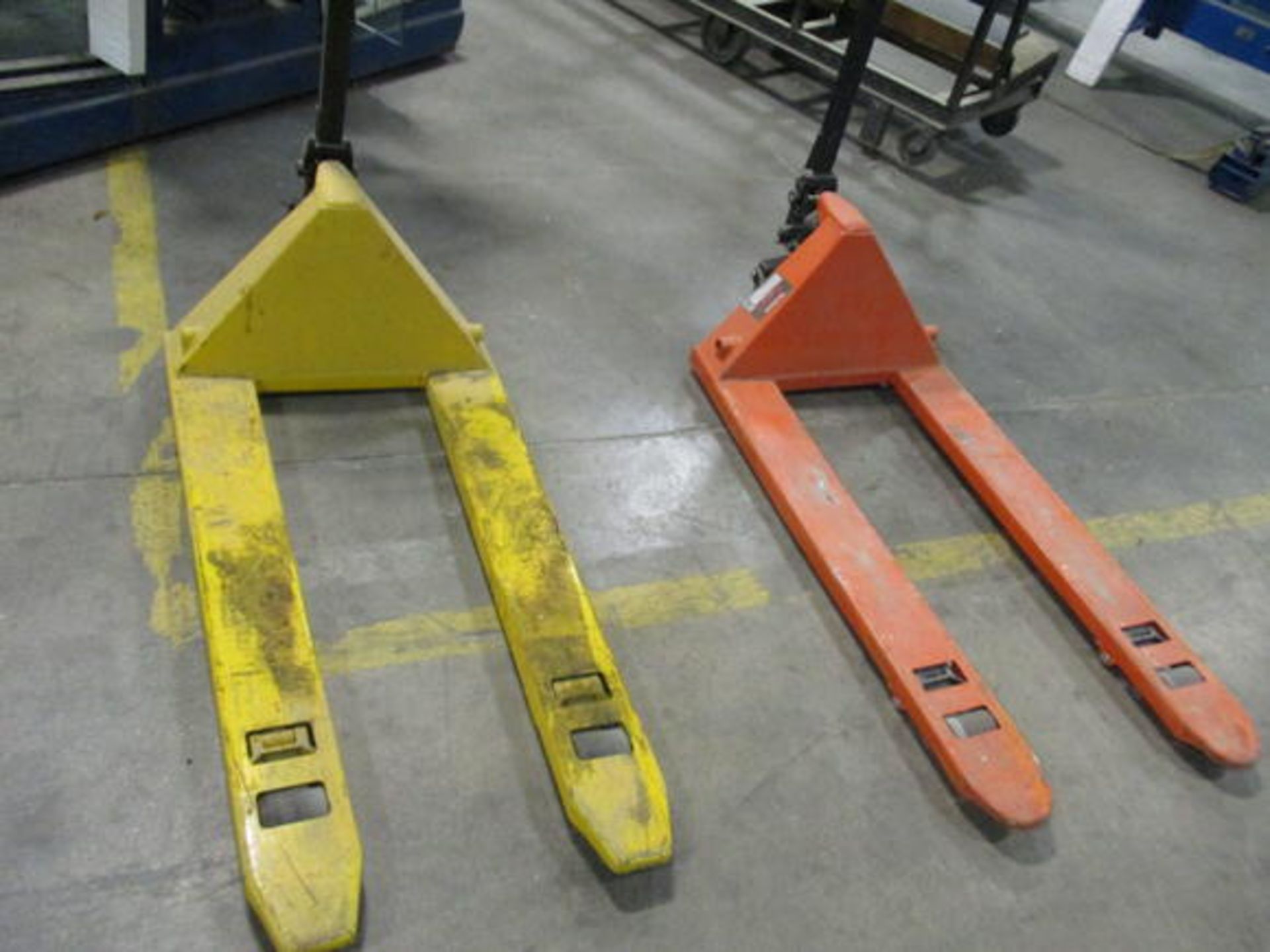 (2) PALLET JACKS (YELLOW NEEDS REPAIR)