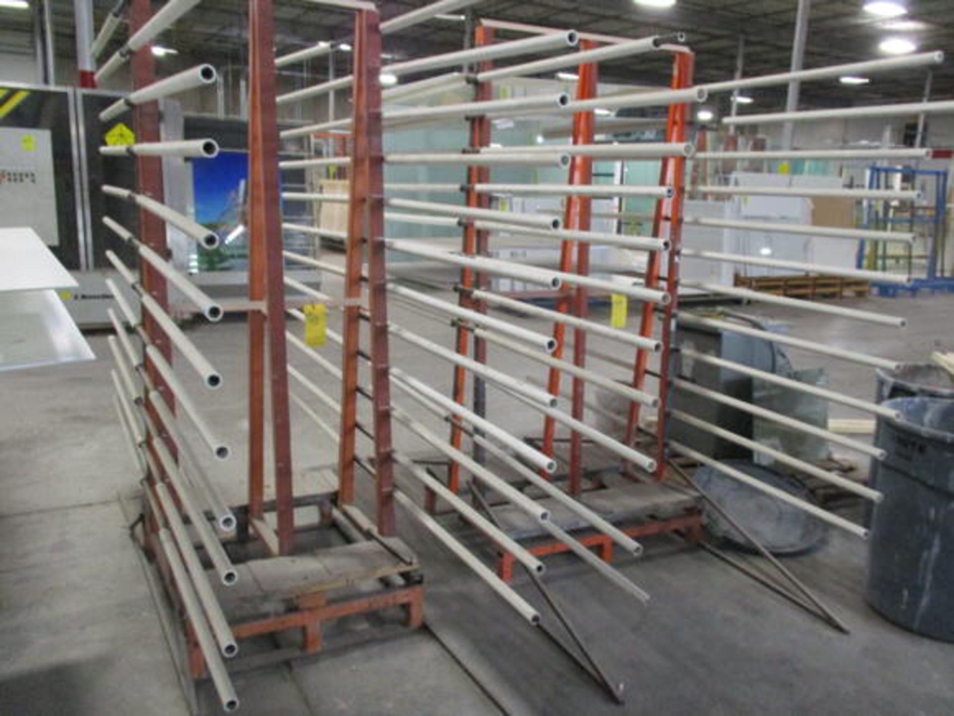 (2) DOUBLE SIDED METAL GLASS RACKS, APPROX 3' X 4' X 7' W/ HORIZONTAL HOLDERS WELDED ON ONE SIDE