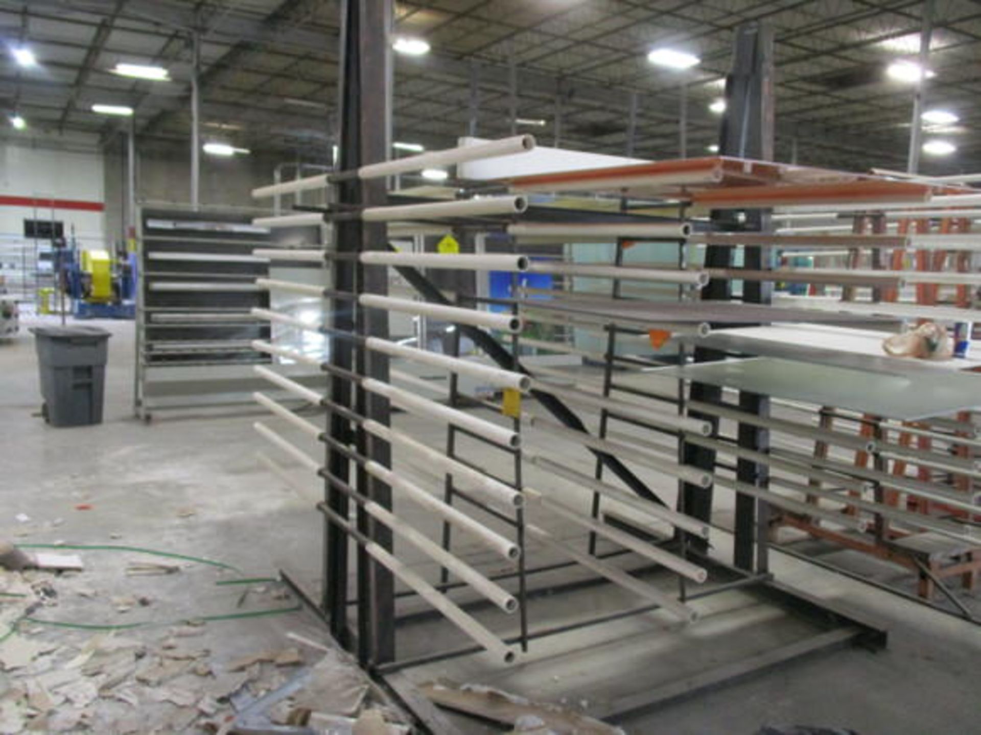 DOUBLE SIDED METAL GLASS RACK, APPROX 10' X 10' X 8' W/ HORIZONTAL HOLDER WELDED ON ONE SIDE