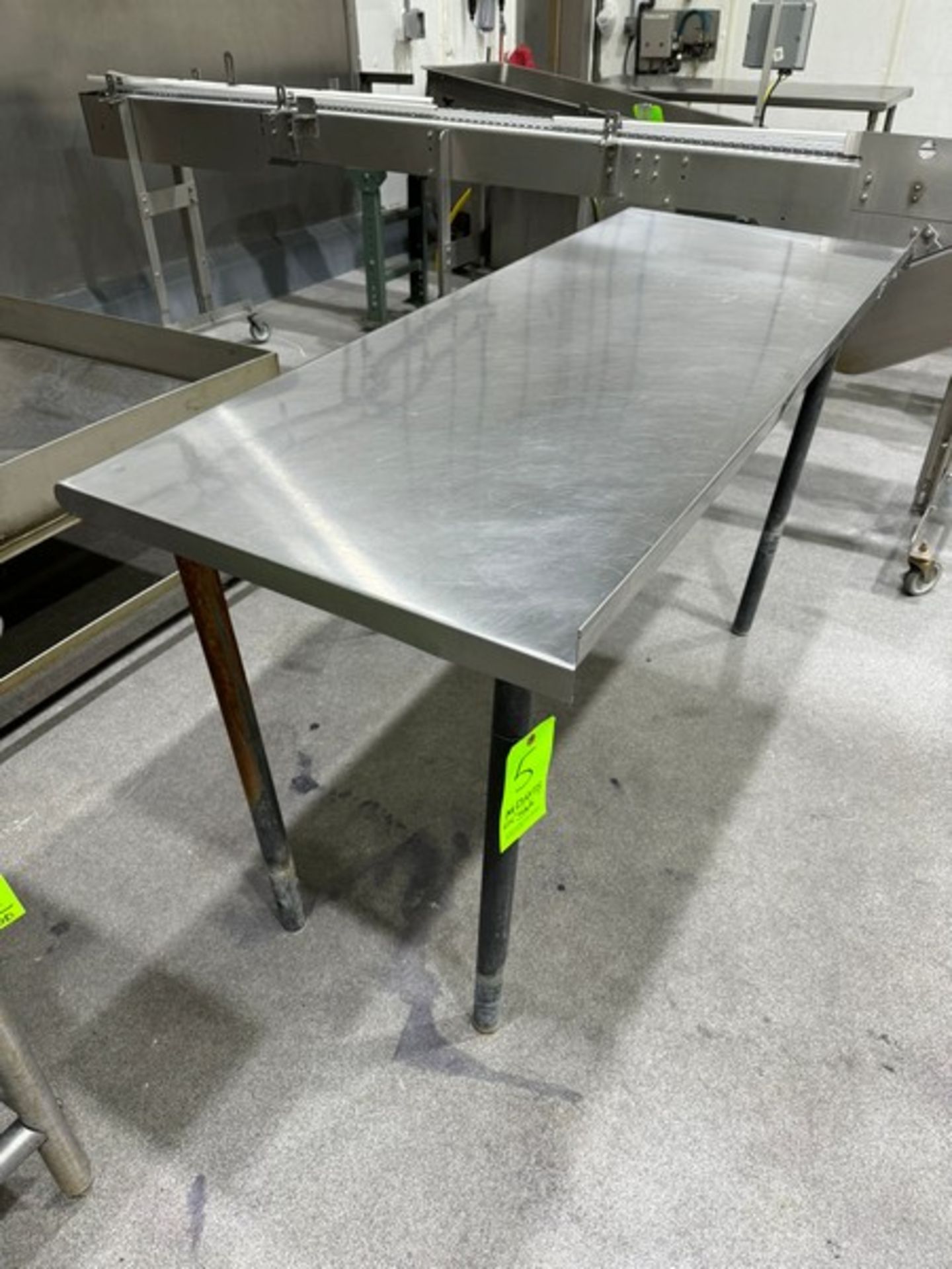 S/S Table with Aprox. 1-1/2” Back Splash, Overall Dims. Aprox. 5 ft. L x 24” W x 33” H, Mounted on