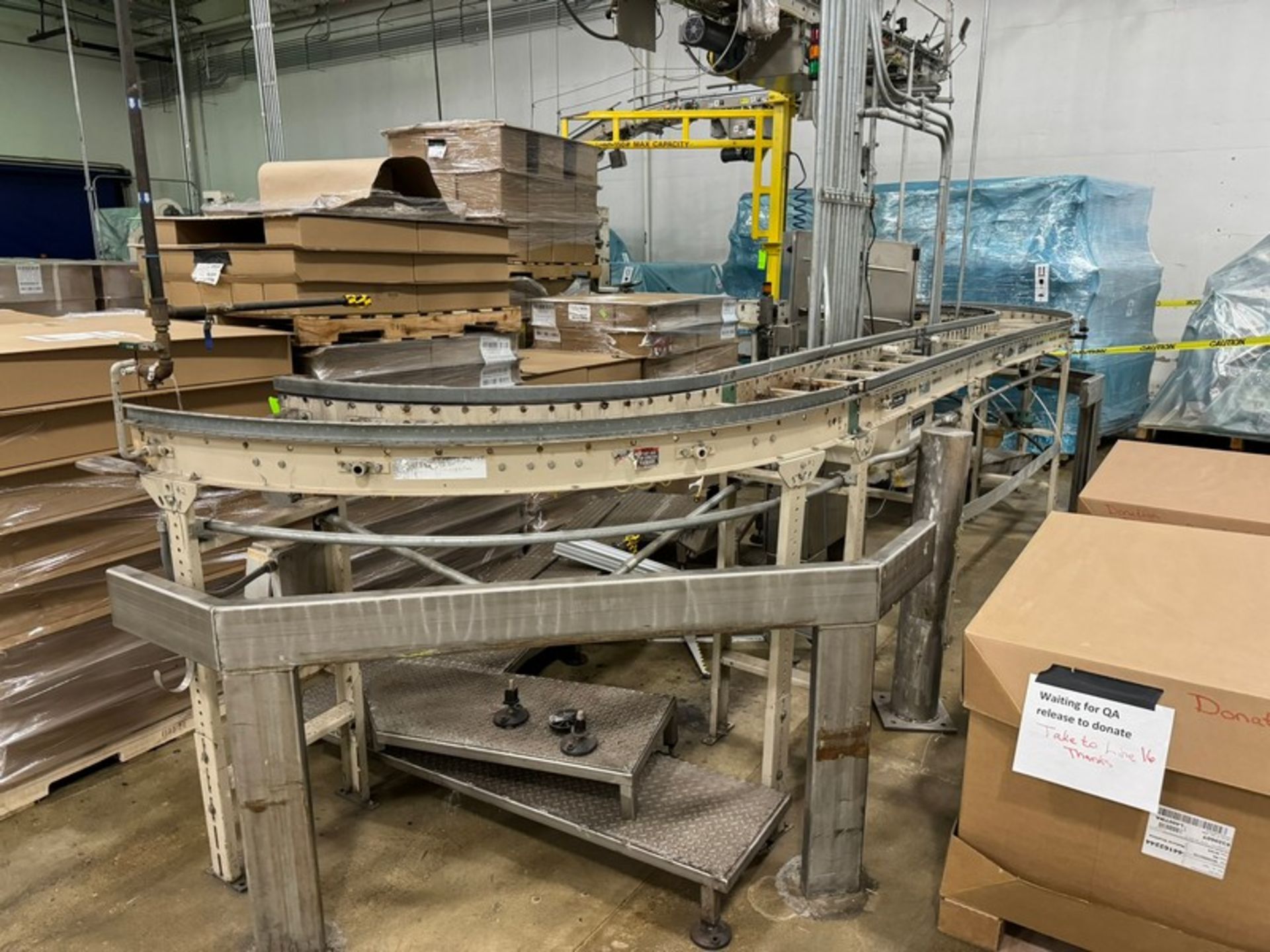 ERMANCO Inc. Roller Conveyor Bed, 180 Degrees Infeed to ARPAC (NOTE: Missing Rolls)