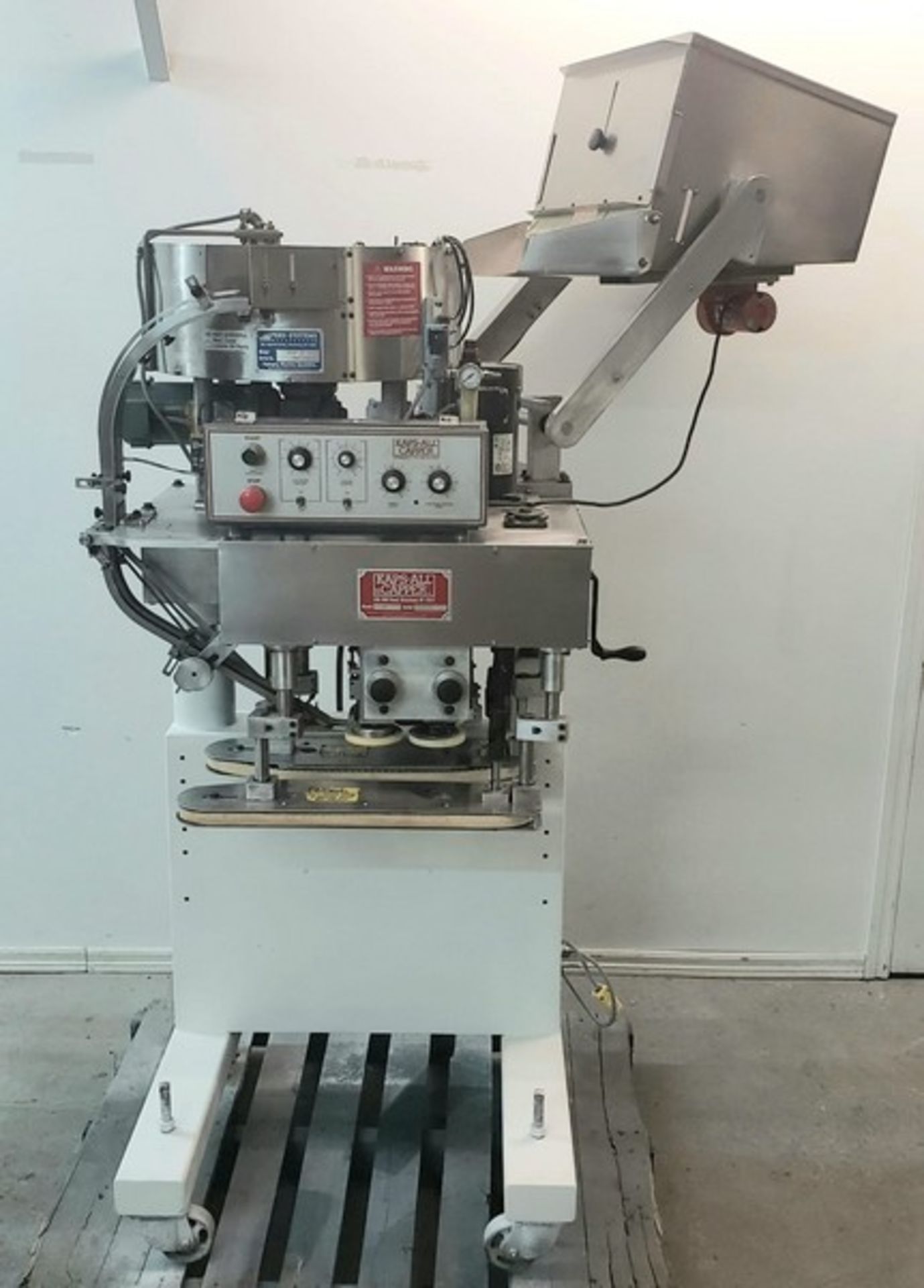 Kaps-All capper Model E. With feeder system Model FSRF-24 in good working condition 120 volts 1