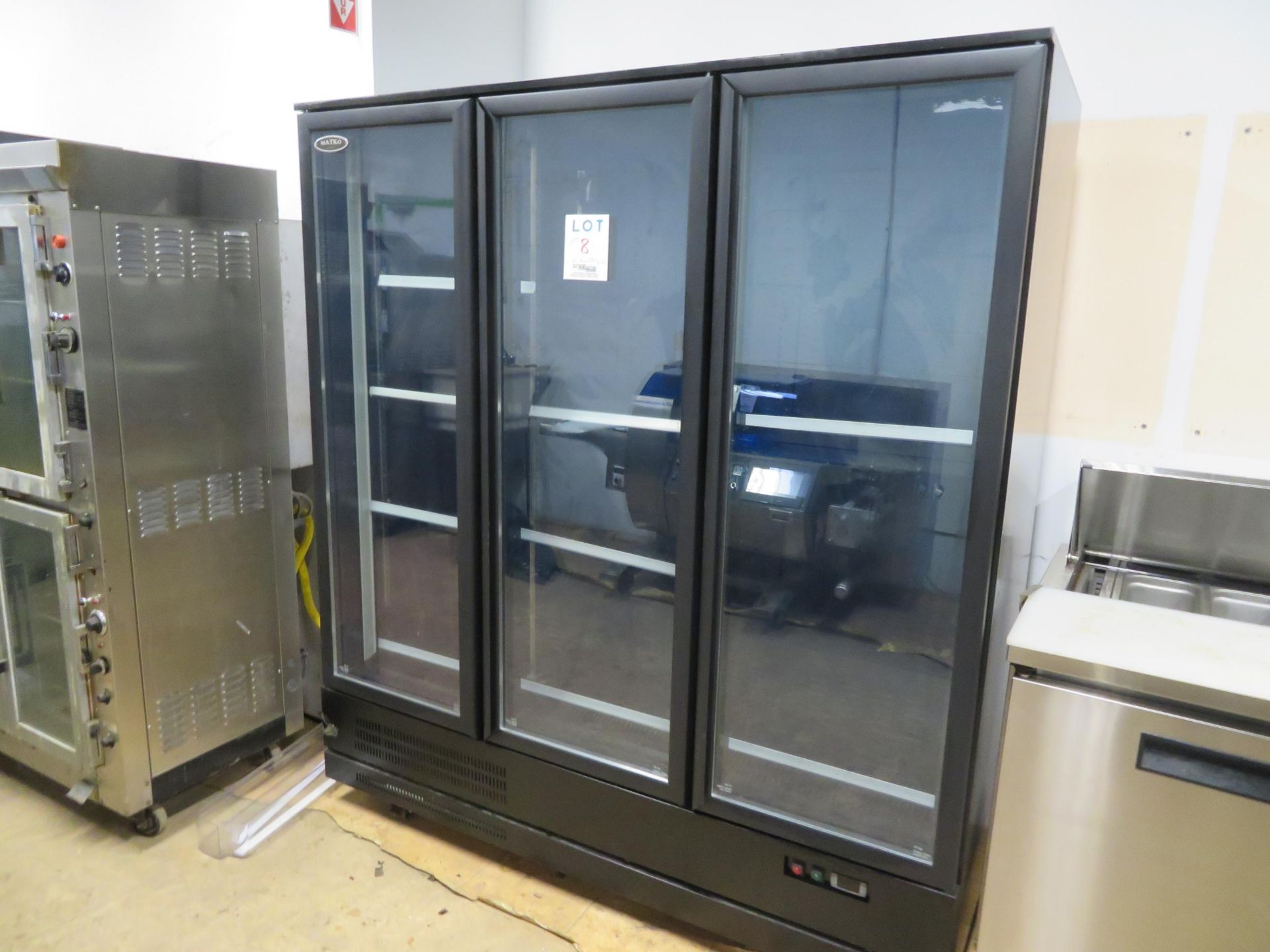 MATKO upright 3 door glass refrigerator on wheels, Mod # RIC-53B, approx. 70"w x 30"d x 79"h