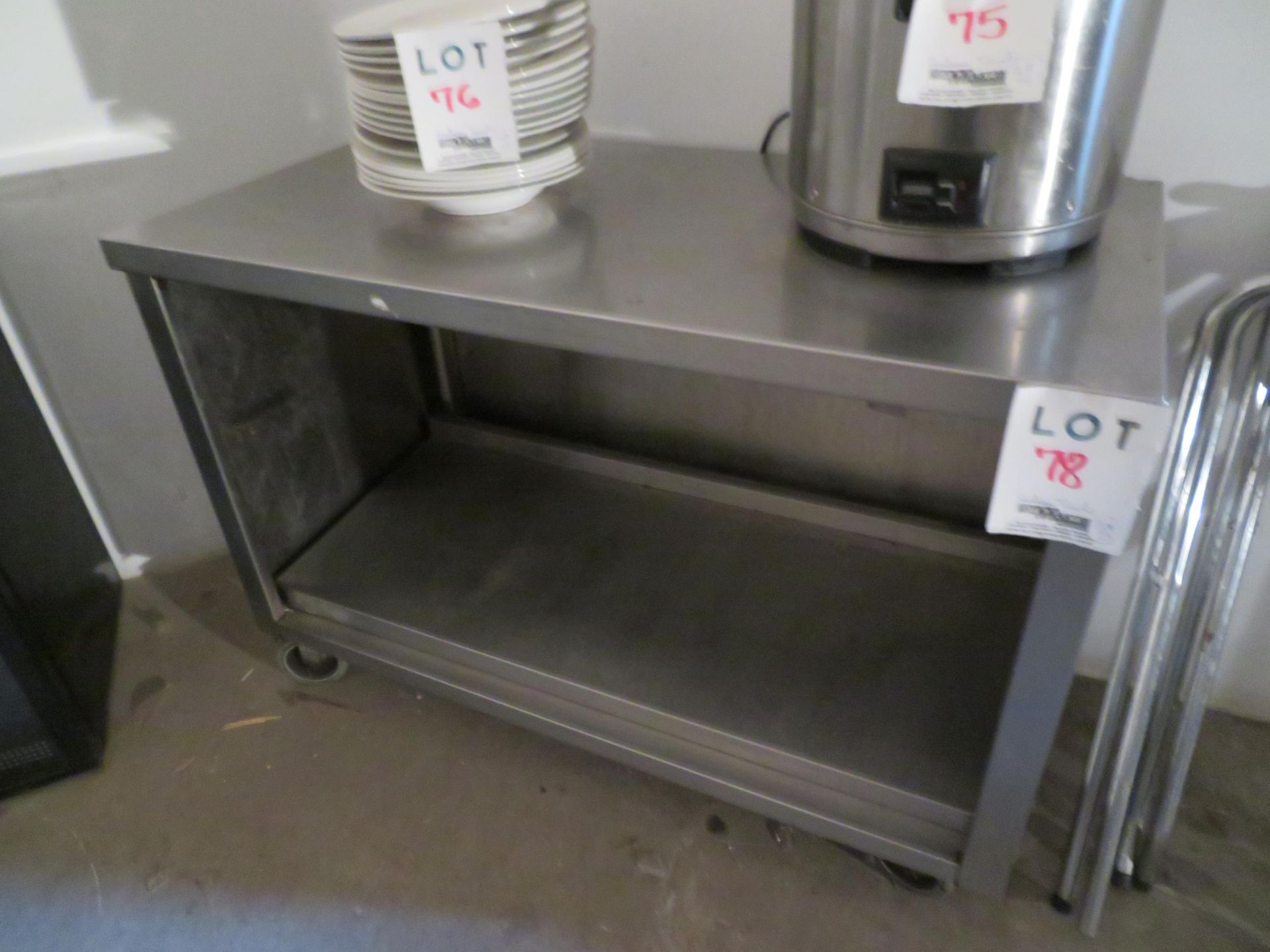Stainless steel table/cabinet on wheels approx. 48"w x 24"d x 34"h