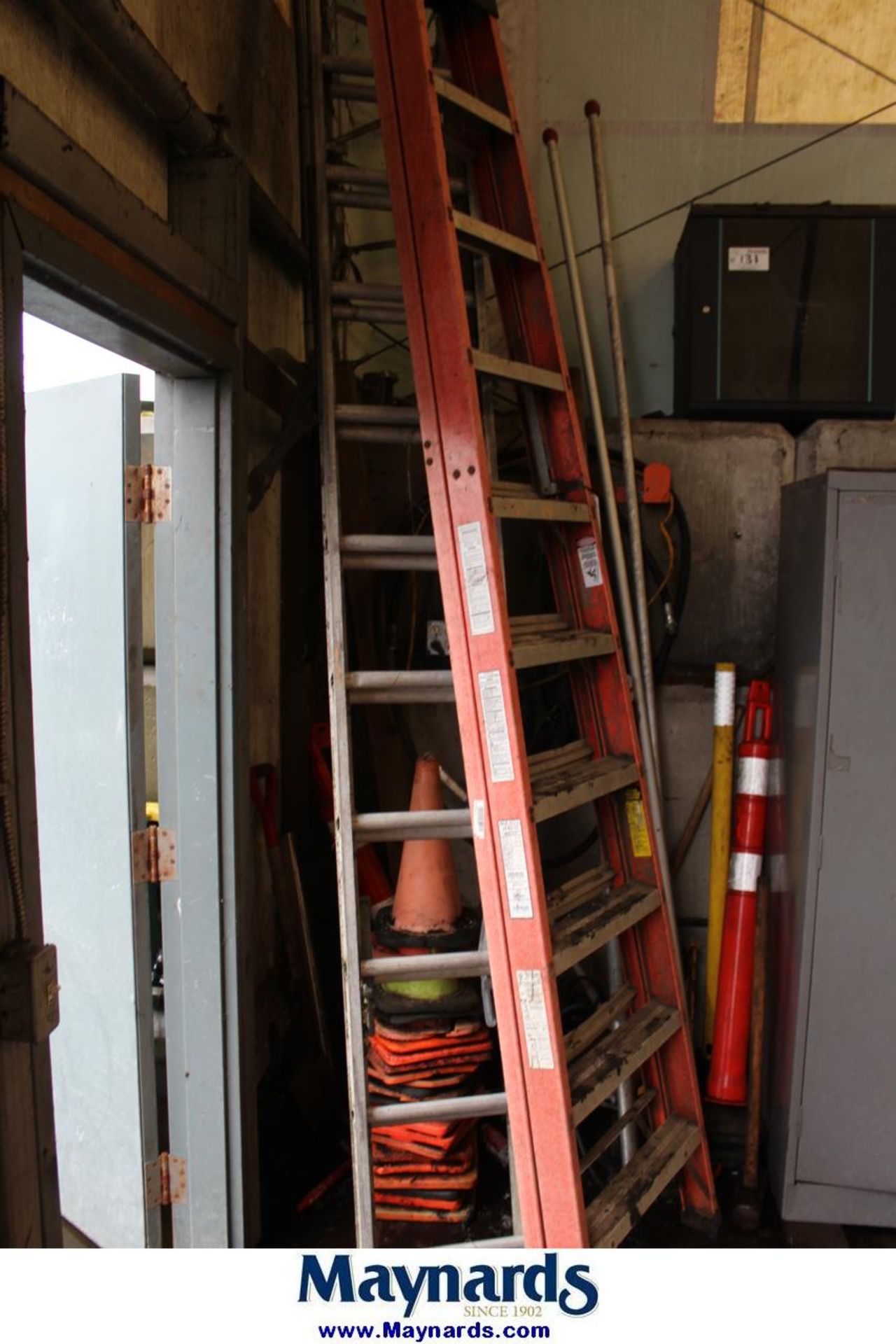 lot of ladders and tools in corner