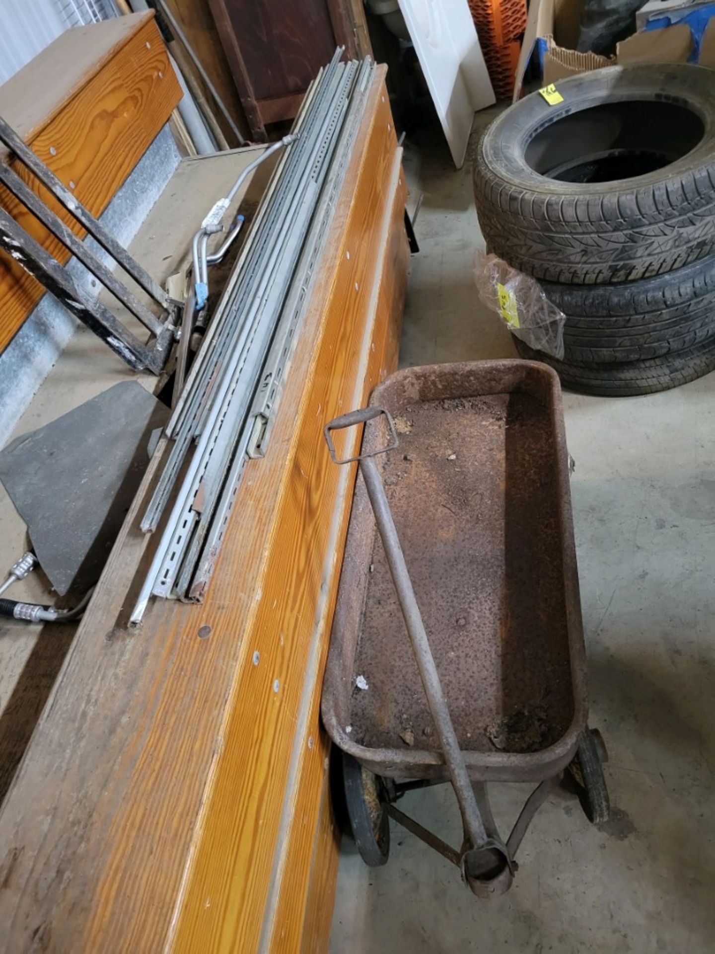 Radio Flyer Wagon And A Large Group Of Shelving Tracks