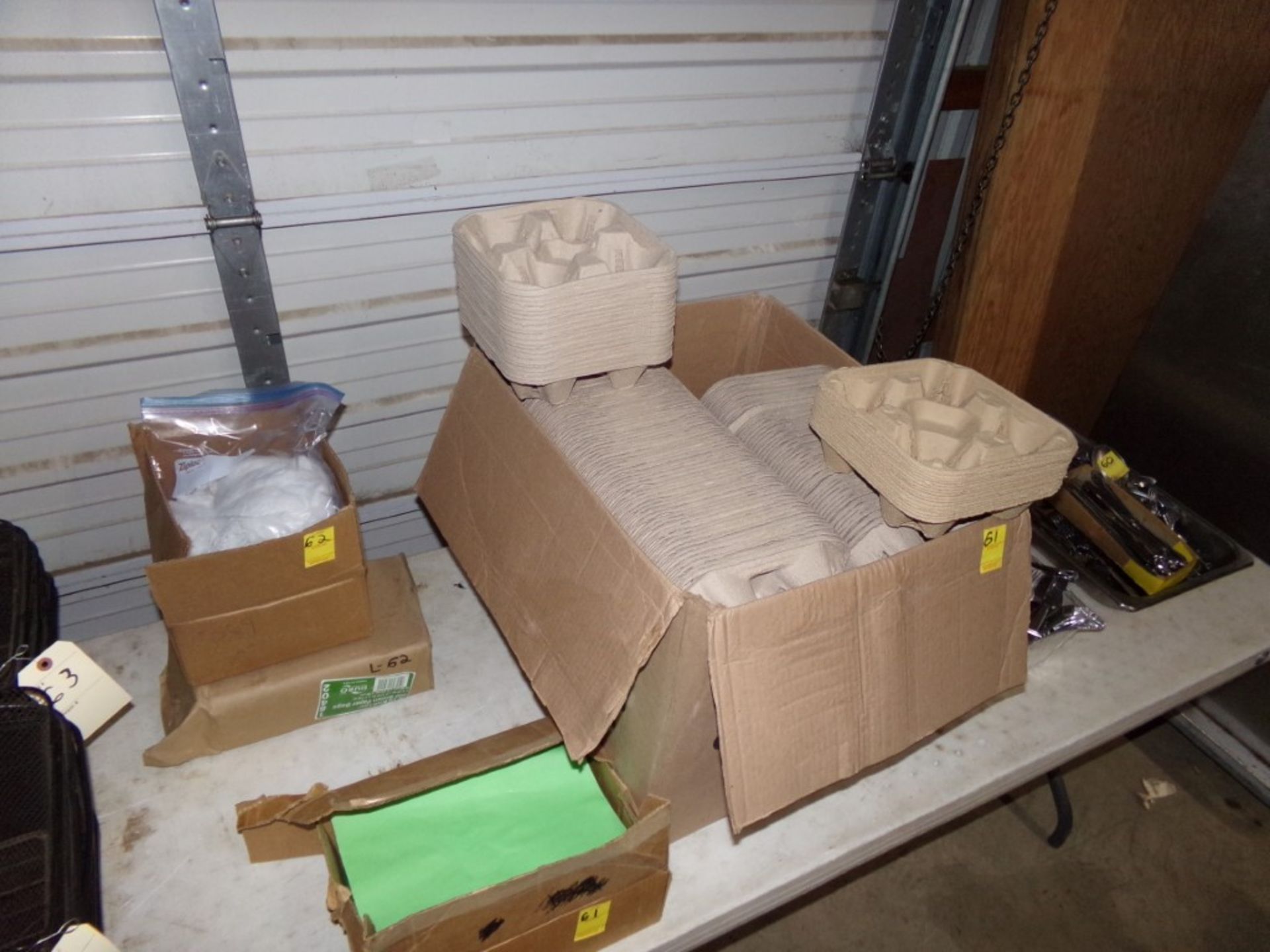 (4) Boxes of Paper Goods, Beard Nets, Drink Carriers, Paper Bags, 8 1/2 X 11 Green Paper