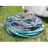 Large Group of Garden Hose and Bucket of Hose Connections (5150)