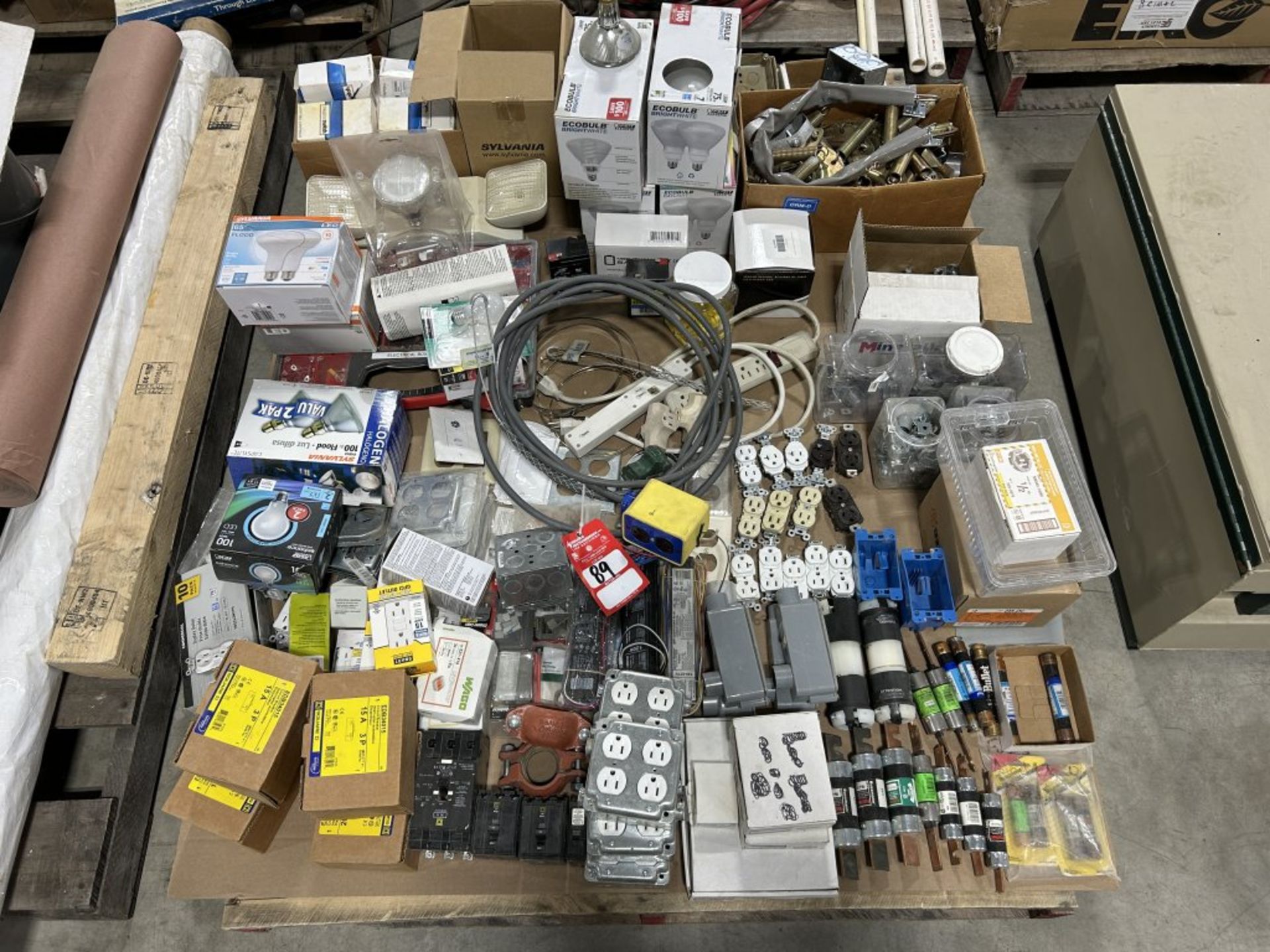 LARGE PALLET FULL OF ASSORTED FUSES, SWITCHES, OUTLETS, LIGHT BULBS, SPRINGS, ETC.
