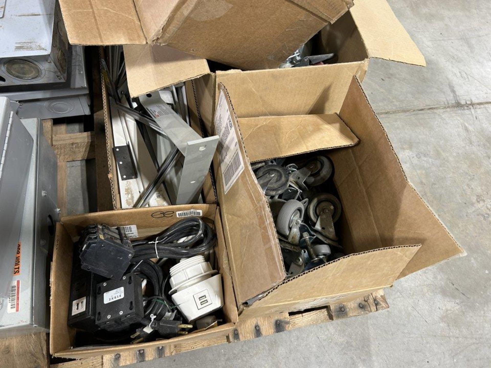 PALLET FULL OF APPROX. (7) ASSORTED SIZE ELECTRICAL PANELS, HAND TRUCK TIRES, CASTERS, BREAKER - Image 5 of 7