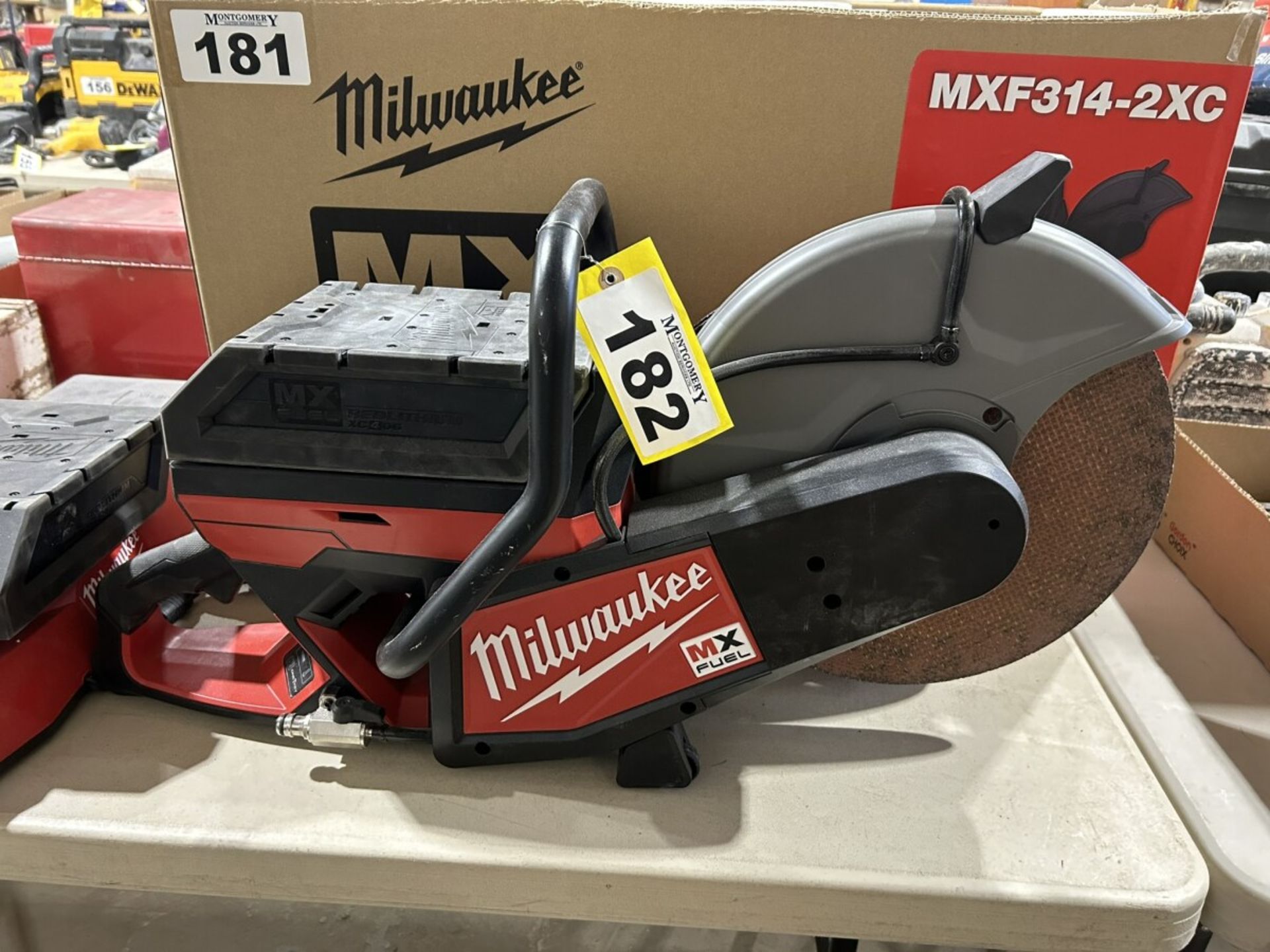 MILWAUKEE MXF314-2XC CORDLESS 14" DEMOLITION SAW W/ 2 XC406 BATTERIES AND CHARGER (USED ONE TIME)