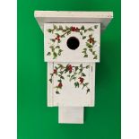 WHITE BIRD HOUSE WITH GREEN VINES AND RED FLOWERS