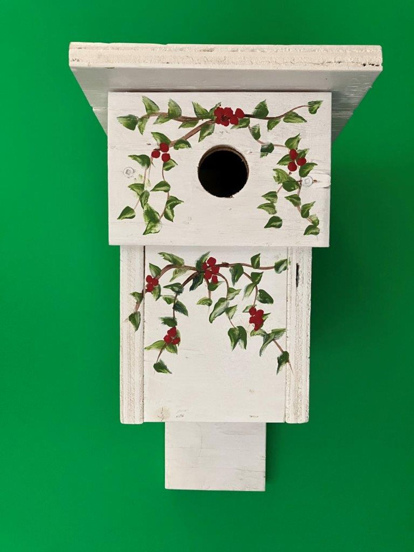 WHITE BIRD HOUSE WITH GREEN VINES AND RED FLOWERS