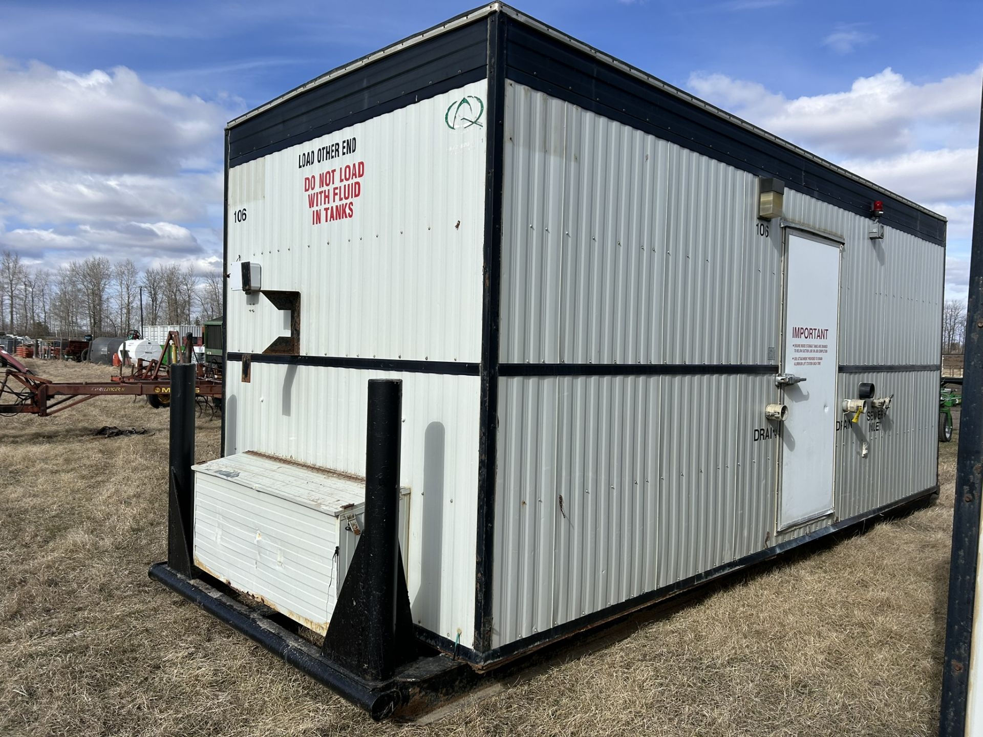 SKIDDED SEWAGE CONTAINMENT BUILDING, HEATED, 13 M3 CAPACITY, 30AMP/1PH, 8'-4"X23'X9' H, S/N