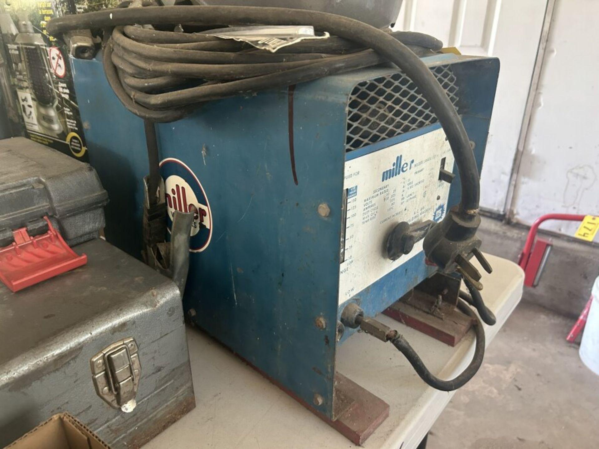 MILLER THUNDER BOLT ARC WELDING POWER SOURCE W/ CABLES AND HELMUT, 240V