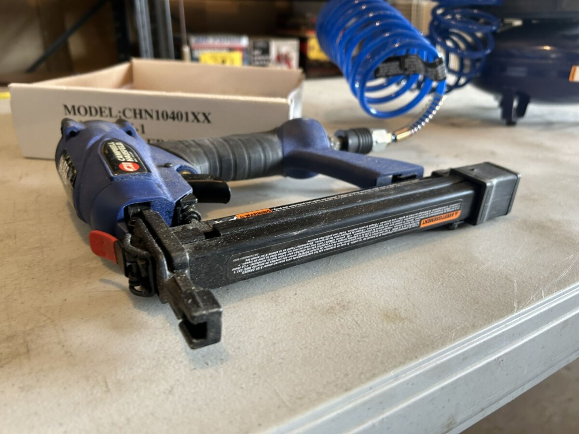 CAMPBELL HAUSFELD PORTABLE AIR COMPRESSOR AND PNEUMATIC BRAD NAILER/STAPLER W/ ASSORTED STAPLES - Image 7 of 9