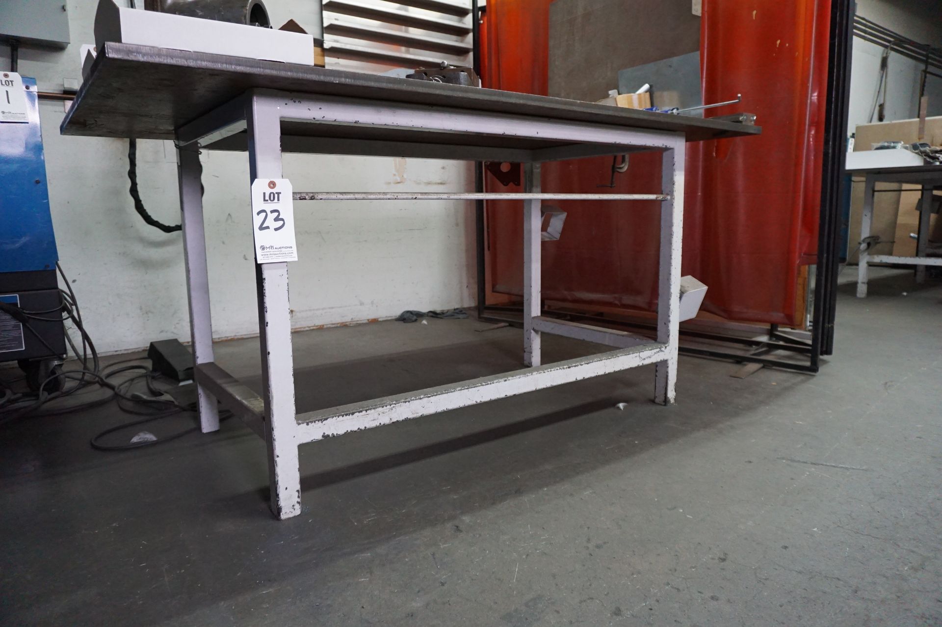 TABLE USED FOR TIG WELDING. 42" X 72" WORKING AREA, 1" THICK HEAVY STEEL TOP, 35" H, NO CONTENTS