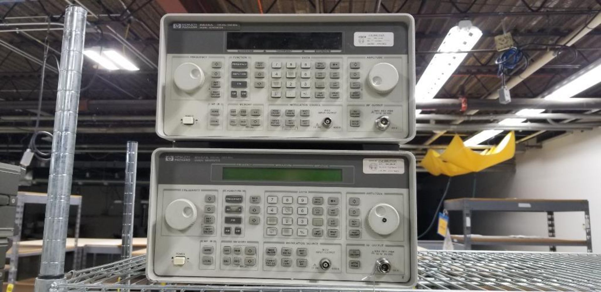 (2x) Hewlett Packard Signal Generators; (1) HP Model 8647A, (1) HP Model 8648A