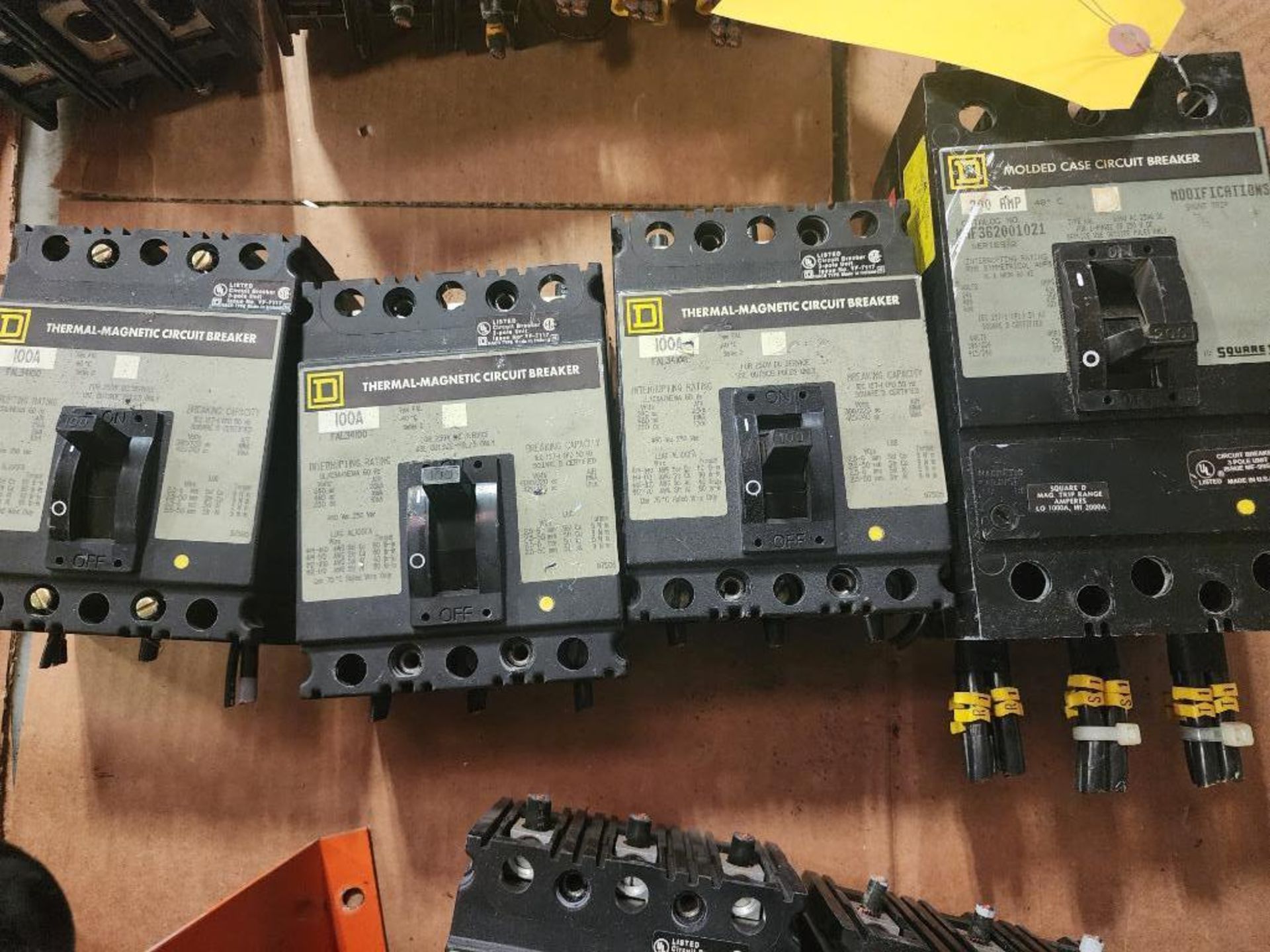 (4) Square D Circuit Breakers; (1) 200 Amp Breaker MNF362001021 & (3) 100 Amp Breakers FAL34106