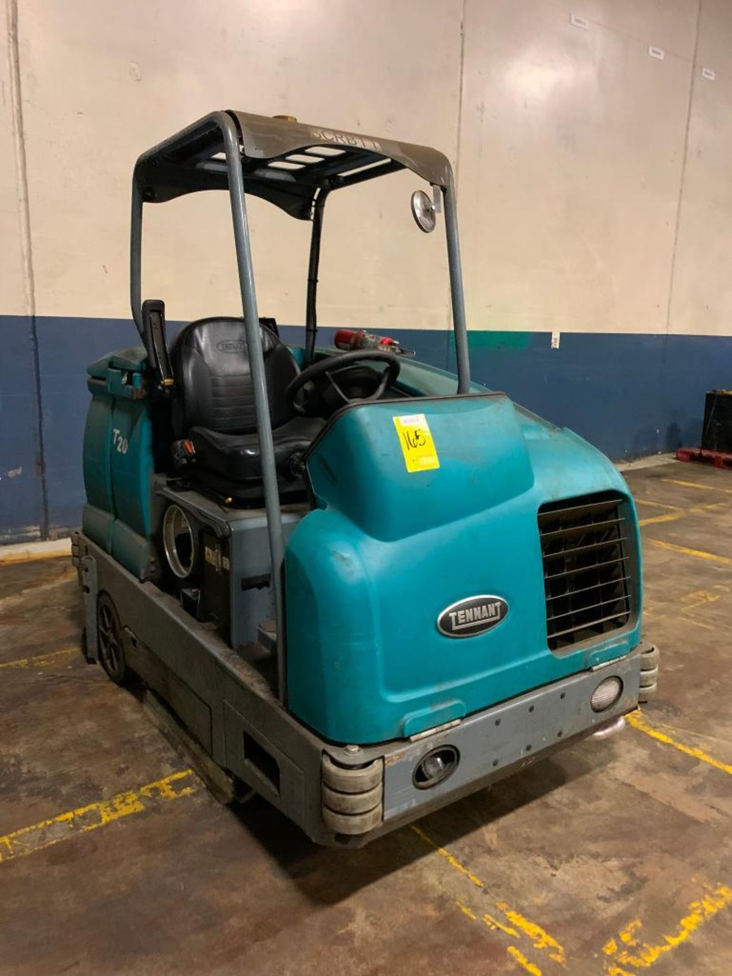 Tennant T-20 Ride-On Floor Scrubber, LPG, S/N T20-10976, 1,356 Hours ($100 Loading Fee will be added