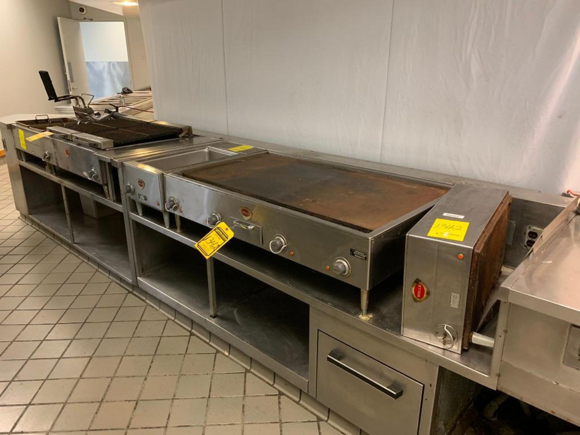 Wells Commercial Kitchen Equipment; Dual Deep Fryer, Twin Lift Top Grill Unit, 47" X 24" Flat Top Co