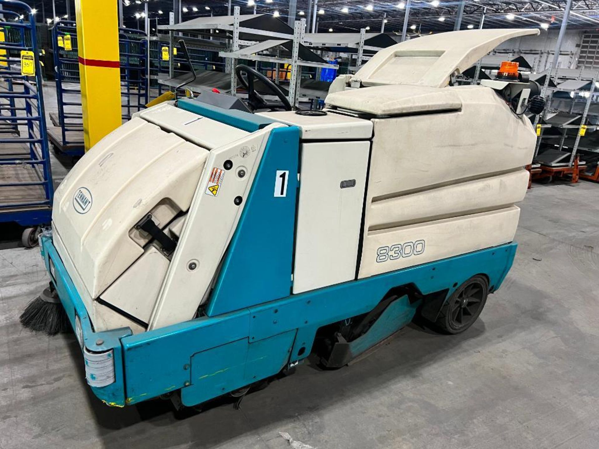 Tenant Battery Powered Ride-On Sweeper/ Scrubber, Model 8300 ($50 Loading fee will be added to buyer