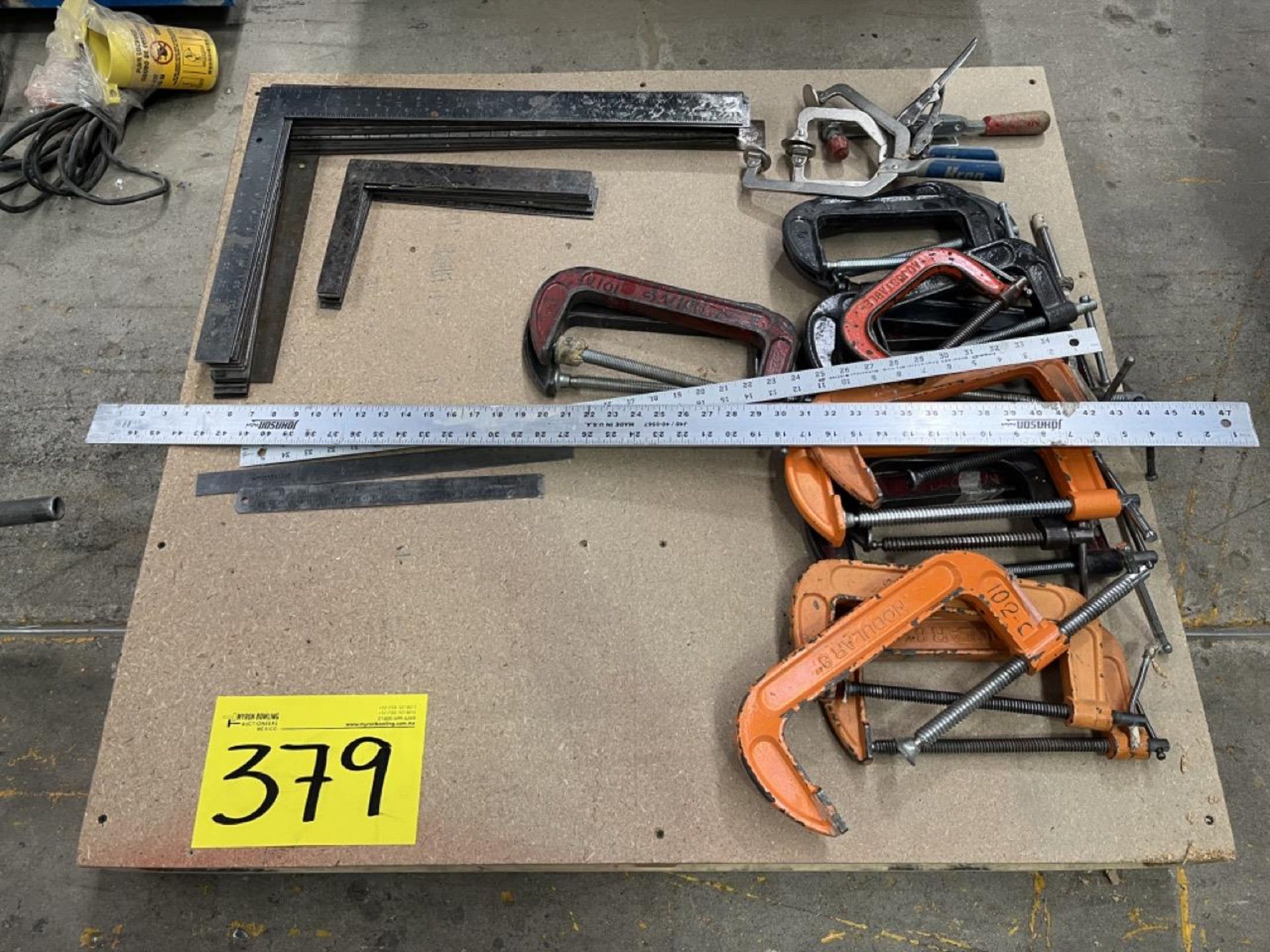 Lot of tool contains: metal squares and rulers, bench presses of different sizes; approximately 45
