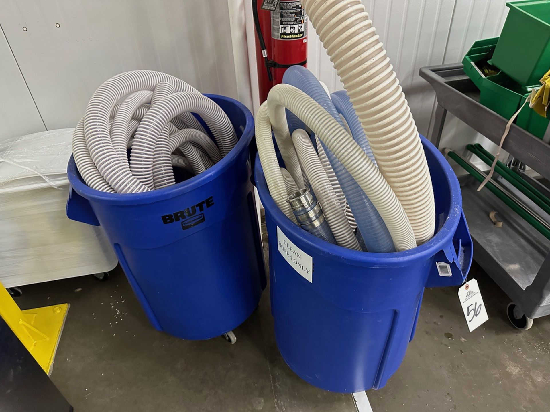 Lot of Assorted Hoses with Rubbermaid Brute Cans on Casters | Rig Fee $35