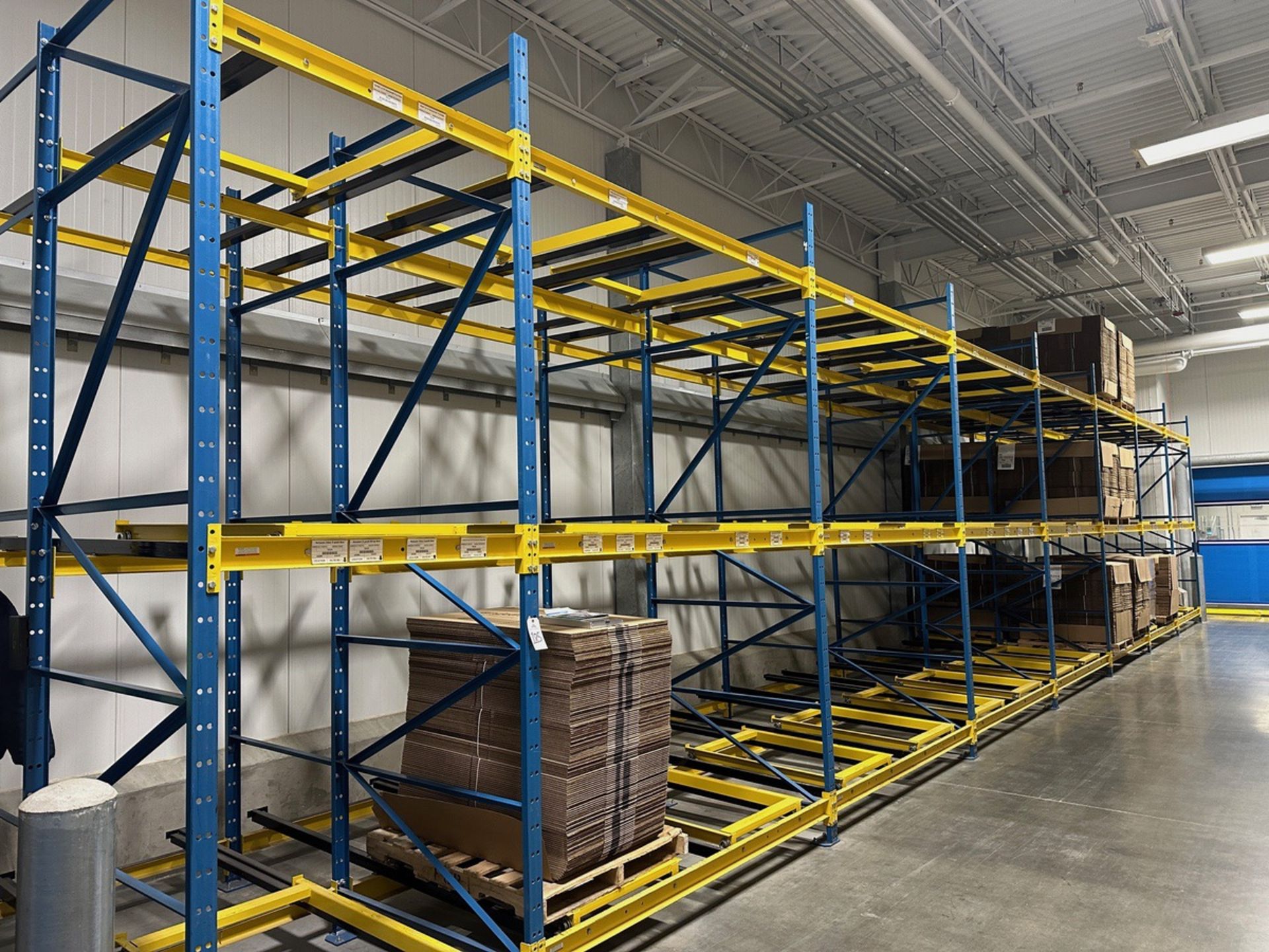 Lot of Gravity Fed Pallet Racking (2 Bays Deep) - (9) 12' x 8' Uprights - (63) 8' C | Rig Fee $2500