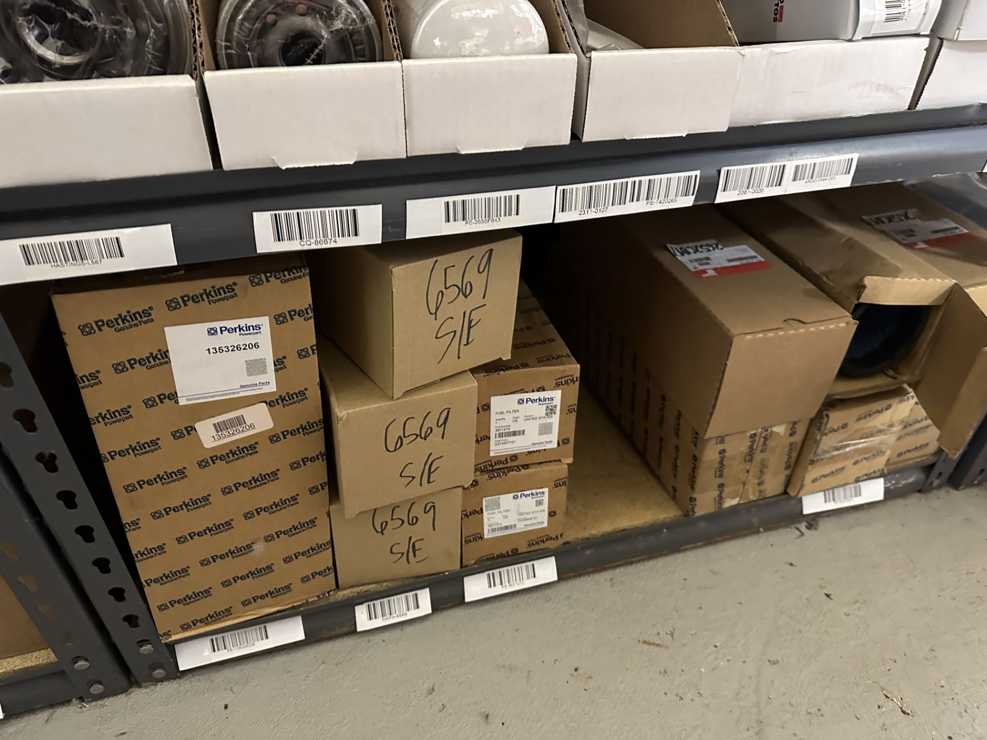 {LOT} Asst. Perkins & Fleetgard Filters On Bottom 2 Shelves of 3 Sections - Image 7 of 10