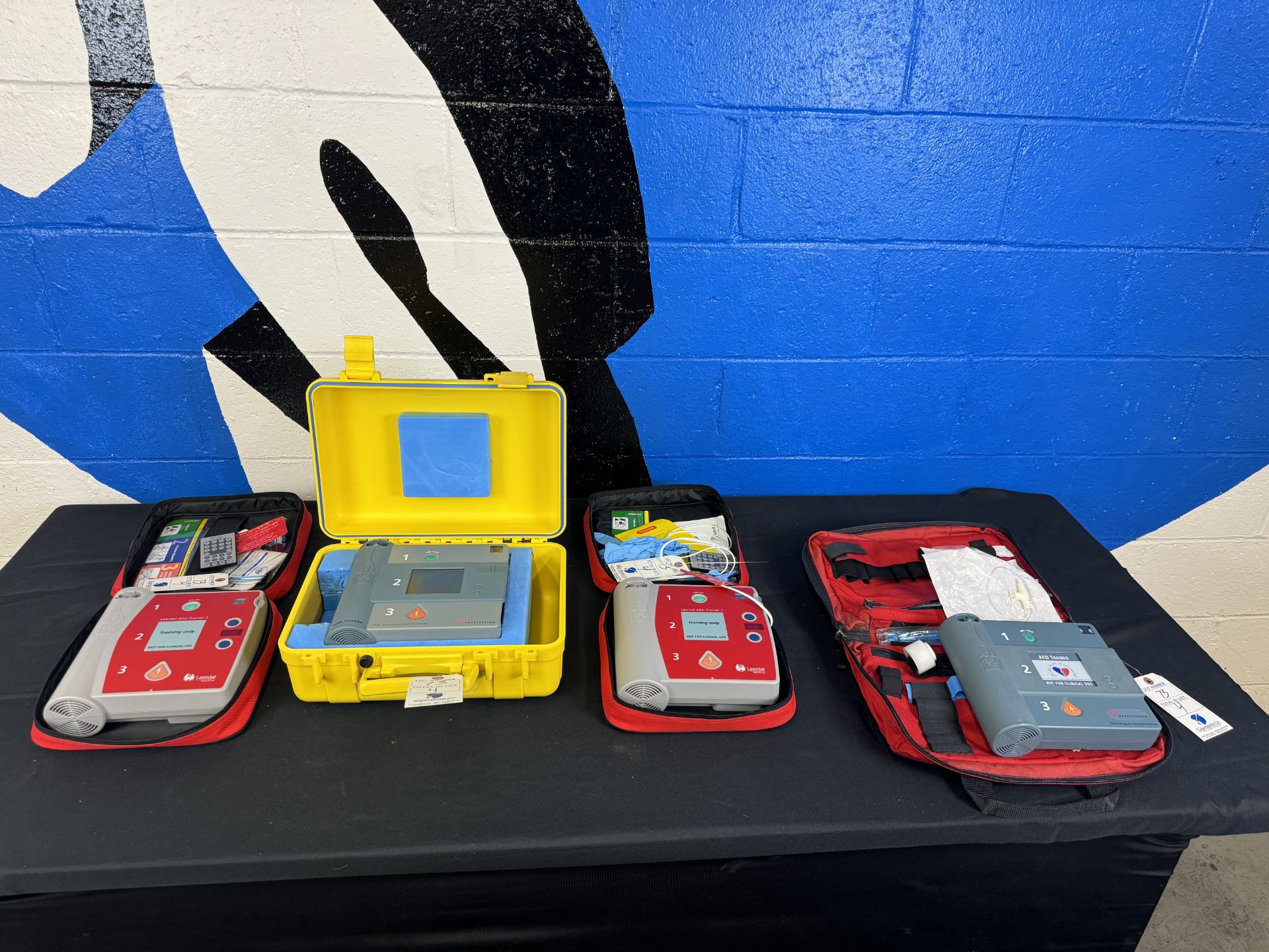 (4) Laerdal and Asst. AED Training Aids