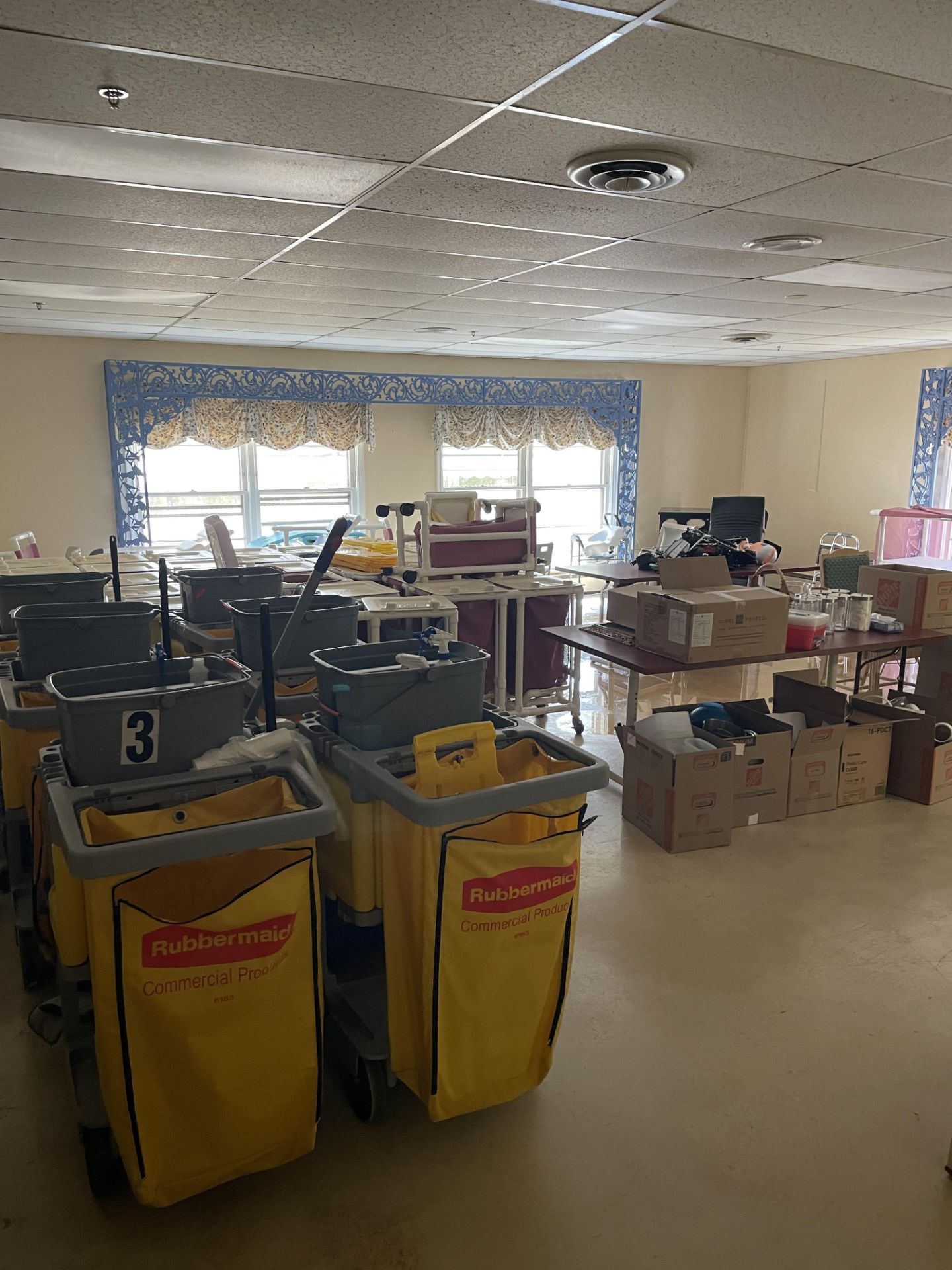 {LOT} In Storage/Janitorial Area c/o: IPU Trash and Laundry Carts, Janitorial Carts, Kitchen Ware,