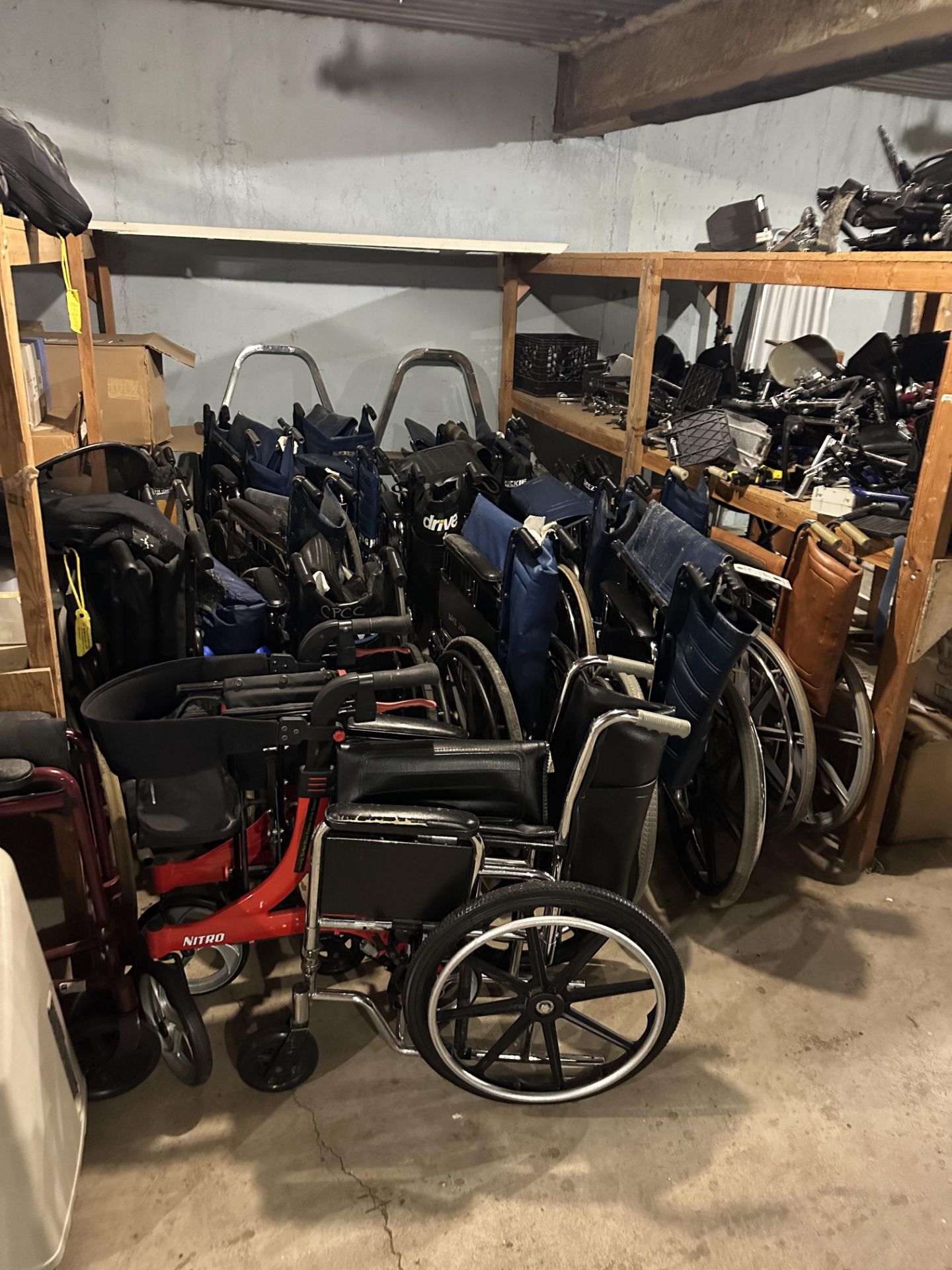 {LOT} Drive & Asst. Wheelchairs in Second Area w/Parts on Racks and Next to Racks