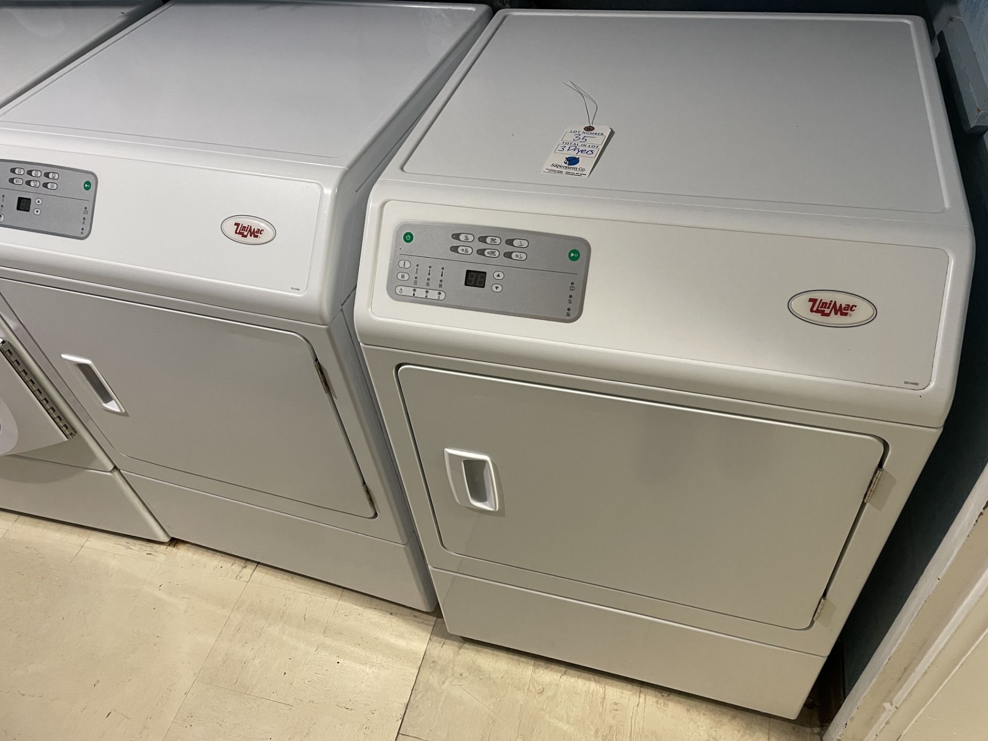 {LOT} In Laundry Area c/o: (3) UniMac #UDEE5BGS173CW01 Electric 3 Wire Plus Ground Commercial Dryers