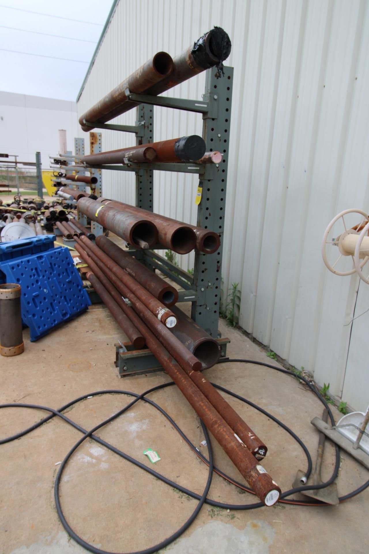 Rotating Tubing Rack LOT OF ALLOY TUBING & ROUNDBAR (on three cantilever racks)