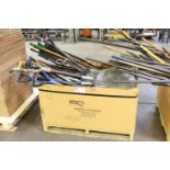 Large assortment of handles and hoes